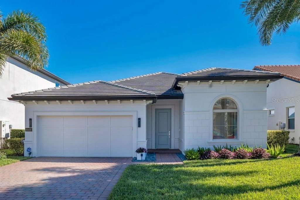 Photo of 10481 Royal Cypress Way, Orlando, FL 32836 (MLS # O6378427)