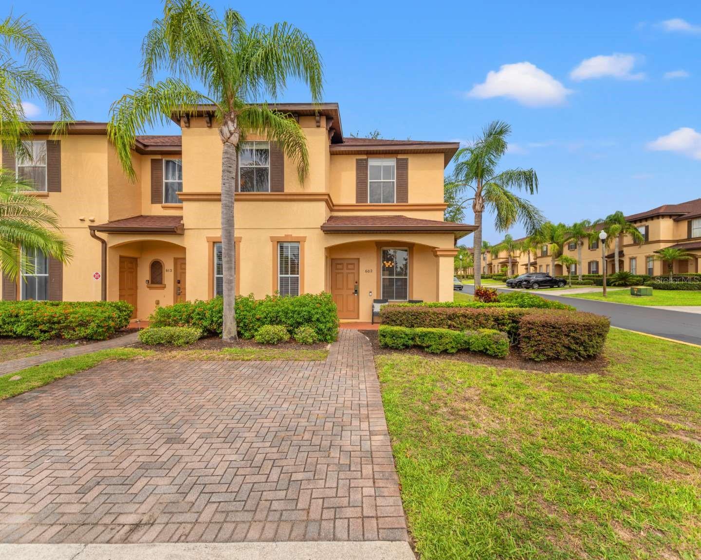 Welcome to Regal Palms Resort — a premier gated vacation and resort-style community just minutes from Disney! This sought-after destination boasts an unbeatable lineup of amenities, including a heated pool with lazy river and waterslide, hot tub, tiki bar, full-service spa, fitness center, arcade, volleyball courts, and more — all just steps from your front door. Located only 9 miles from Disney, this spacious 4-bedroom, 3.5-bath end-unit townhome offers the largest floor plan in the resort and sits on a private corner lot with no front neighbors, providing peaceful views and added privacy. Inside, you’ll find two master suites (including a lock-out main unit master), screened-in patios, and private driveway parking for up to three vehicles. The home has been tastefully updated, comes fully-furnished, and is just a short 0.1-mile walk to all resort amenities—plus walkable access to restaurants, coffee shops, and groceries. Whether you're searching for a full-time residence, a vacation escape, or a profitable short-term rental, this home offers the ideal blend of comfort, location, and resort living. Schedule your tour today and experience the tranquility for yourself! Seller is a licensed real estate agent in the state of Iowa