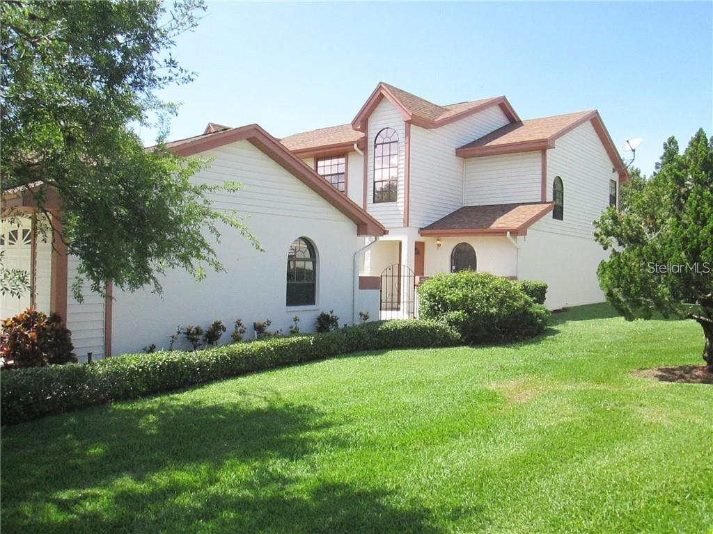 This rarely available 3-bedroom, 3-bathroom end unit townhome in the peaceful Feather Cove community offers 2,023 sq. ft. of living space, plus a large detached two-car garage. Nestled in a quiet neighborhood, the home features a private paved courtyard entry, ideal for relaxing and reading a book, outdoor grilling or entertaining. Upon entering, you're greeted by an expansive living room and Florida room combination with windows spanning the back, allowing natural light to flood the space and offering views of the wooded conservation area. The gourmet kitchen is a chef’s dream, boasting granite countertops, beautiful cabinetry, stainless steel appliances, a breakfast bar, and an open dining area with custom-built cabinetry. The first floor also includes a spacious bedroom with a built in closet, a full bath, and a separate large laundry room for added convenience. Upstairs, the primary bedroom offers a luxurious retreat, measuring 17x18, with vaulted ceilings, a private ensuite bathroom featuring a jacuzzi tub, and a large walk-in closet. A third bedroom and additional full bath are also on the second level. The home also includes a water softener and a low quarterly HOA fee of just $1,050, with no applications required for owner/occupants and small pets permitted. The community offers a heated pool overlooking a picturesque bird sanctuary, providing a tranquil space to relax. Residents of the Feather Sound Country Club have access to amenities such as golf, tennis, a neighborhood park, and a basketball court. Located with quick access to I-275, Tampa International Airport, local beaches, Carillon Office Park, and the Baycare Outpatient & Wellness Center, this move-in ready townhome combines privacy, comfort, and modern living in a highly sought-after area. Call today to schedule a tour of this move in ready home!