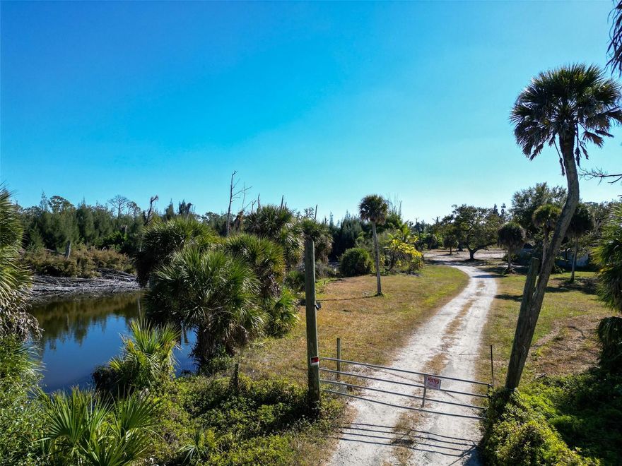 Fantastic opportunity to build your dream home on a large, private 6.4-acre lot in the highly desirable Englewood Gardens community, just minutes from Manasota Key. This expansive property features a large private pond, mature oak and magnolia trees.  Ample space to accommodate the horses, boat or RV. One of the significant advantages of this location is that Englewood Gardens has no CDD fees or HOA restrictions. Residents enjoy exceptional local amenities and easy access to the surrounding area. You can spend your days relaxing on Manasota Beach or exploring historic Dearborn Street, which is home to local boutiques, coffee shops, an art gallery, dining, live music, and a seasonal weekly farmer’s market.  Become a member of the nearby Manasota Beach Club—a private, beachside club providing exclusive access to 300 ft of private beach, two decks - one gulf front and the other shaded under the oak trees, pool and pool house, picnic area, kayak storage and launch to Lemon Bay. Or, join the Englewood Gardens Beach Club Build and enjoy a private beach, bay access, clubhouse, monthly food trucks and live music.  Build your piece of paradise!