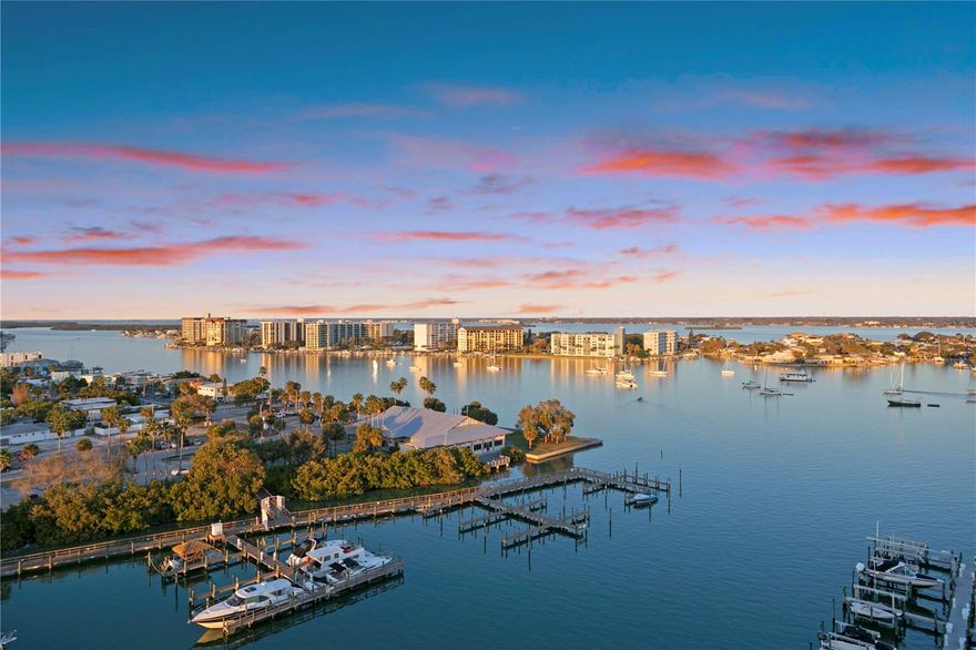 Welcome to Penthouse 1210 at Belle Harbor, a truly exceptional waterfront residence located at 521 Mandalay Avenue in the heart of Clearwater Beach. Offering over 3,426 square feet of interior living space and an additional 575 square feet across four expansive balconies (each bedroom has private balcony access), this 3-bedroom, 3.5-bathroom penthouse delivers an unparalleled blend of scale, sophistication, and sweeping coastal views. 
Designed for both elegance and comfort, the residence features travertine and ceramic tile flooring throughout the main living areas, expansive windows, and a thoughtfully designed layout that flows seamlessly from indoors to out. The four large balconies wrap the entire penthouse, creating multiple vantage points to enjoy sunrise and sunset, lending to one of the most visually stunning vantage points in all of Clearwater Beach. Additionally, this unit features a beautifully updated, custom kitchen with high end appliances, millwork range hood, bar seating, and butler’s pantry. Additional rooms include, formal dining space, family room, living room, indoor laundry room, and breakfast nook with panoramic views. 
This listing is further enhanced by a private 45’ boat slip with 15k lift, and water and electrical, two reserved, side-by-side, covered parking spaces, and a climate-controlled storage unit—a rare and highly coveted combination. This penthouse must be experienced in person to fully appreciate its scale, views, and lifestyle. 
An extraordinary opportunity to own one of Belle Harbor’s finest residences on Clearwater Beach.
Belle Harbor is one of Clearwater Beach’s premier luxury condominium complexes, set on six acres of prime waterfront and offering a full suite of resort-style amenities. Residents enjoy 24/7 manned security, a heated pool and spa, fitness center, clubhouse and lounge, billiards room, assigned under-building parking, and a 65-slip private marina. The location places you just moments from Clearwater Beach’s renowned dining, shopping, and year-round activities.