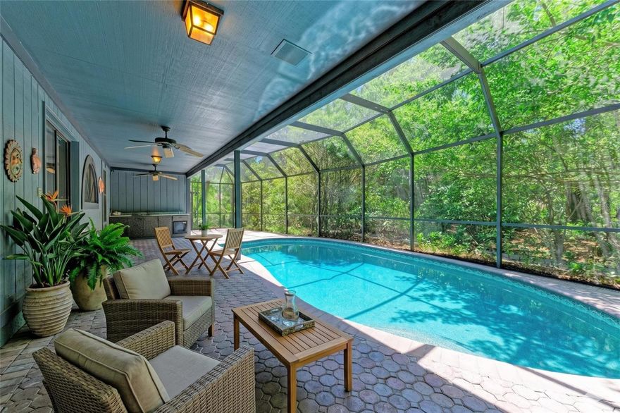 -Rare one-story, cul-de-sac lot backing directly to a private nature preserve — one of Woodland Park’s most secluded settings.
-Upon entering you will find vaulted ceilings, rich Brazilian cherrywood floors, and walls of windows that frame preserve views from nearly every room. 
-A wood-burning fireplace and custom staircase anchor the main living area, while skylights flood the space with natural light throughout the day.
-The outdoor living is equally impressive — a private covered and screened pool deck creates a year-round retreat that’s as suited for quiet mornings as it is for entertaining.
-Recent updates include a BRAND-NEW ROOF and a replacement AC system installed in 2024, so the big-ticket items are already handled.
-Low HOA fees of just $65/month. 
-Woodland Park — oak-canopied streets, nature preserve access, and Old Florida character that’s increasingly rare to find.