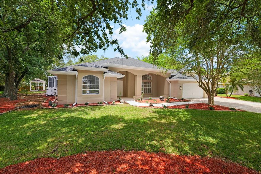 One or more photo(s) has been virtually staged. Welcome to this pristine single-story residence located in the sought-after Walden Lake Community Association. Thoughtfully remodeled with attention to detail, this 4-bedroom, 3-bathroom home offers 2,512 square feet of refined living space designed for comfort, functionality, and modern living.

The open-concept layout provides a seamless flow between the living, dining, and kitchen areas, enhanced by abundant natural light and a warm, inviting ambiance. The kitchen features contemporary cabinetry, sleek countertops, and new stainless-steel appliances. Throughout the home, brand-new flooring, modern light fixtures, ceiling fans, and updated faucets contribute to a cohesive and elevated design. A beautifully finished fireplace anchors the main living area, creating an elegant focal point for gatherings.

The primary suite offers a private retreat with a well-appointed en-suite bathroom and generous closet space. Additional bedrooms provide versatility for guests, work, or hobbies. The home’s single-level design enhances accessibility and ease of living.

Outdoor living is elevated with a heated, screened-in pool, an outdoor kitchen, and ample patio space ideal for relaxing or entertaining. The property’s peaceful lake view adds a serene backdrop to the outdoor experience. Situated on a 0.41-acre lot, the home offers room to enjoy the Florida lifestyle both indoors and out.

The 3-car garage provides extensive storage options and space for multiple vehicles. Major improvements include a new roof (2024), new A/C, new water heater, and new interior and exterior paint, offering added peace of mind.

Conveniently located near downtown Plant City, local parks, dining, shopping, and major roadways, this home provides accessibility to everyday conveniences while maintaining a tranquil residential setting.

Move-in ready and beautifully updated, this residence presents an exceptional opportunity within a well-established community. Schedule your visit to experience the quality and sophistication of this remarkable home.