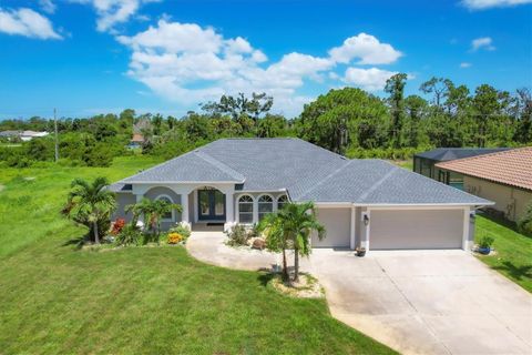 Photo of 423 Boundary Boulevard, Rotonda West, FL 33947 (MLS # D6142600)