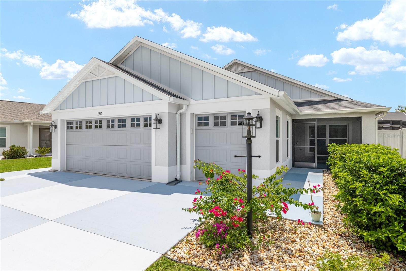 Welcome to THE VILLAGE OF ST. JOHN! This elegant, low maintenance COURTYARD VILLA "AVONDALE MODEL" is perfect for those seeking privacy, enclosed space for a pet or those who wish to spend a little less time caring for a yard and more time enjoying the lifestyle.The property features three-bedroom, two bath, two-car, golf-cart garage, all situated on a 0.30-ACRE CORNER LOT that offers COMPLETE PRIVACY and ROOM FOR A POOL. With a NEW BIRDCAGE and POND VIEW it's quite SPECTACULAR! As you step inside, you'll be greeted by a spacious living area filled with natural light, ideal for relaxation or entertaining guests. The well-appointed kitchen features modern STAINLESS STEEL appliances, ample CABINET and COUNTER SPACE. A large DINING ROOM area, with views of the backyard. A Large LIVING ROOM with views of the back yard. The owner's suite features LARGE WALK-IN CLOSET and an ENSUITE BATHROOM, ROMAN WALK-IN SHOWER, DUAL SINKS and tile flooring. Guests will enjoy their own private space with separate hallway, full bathroom, and both rooms with built-in closets. Additional highlights include an INDOOR LAUNDRY room with utility sink, washer, gas dryer, a NEW BIRDCAGE with ROOM FOR A POOL and a SCREEN-IN FRONT PORCH, for enjoying VIEWS OF THE POND. Conveniently located just a few miles to Sawgrass Grove and Brownwood Paddock Square and all the excitement of the newest Town Center, Eastport. There are many Golf Courses nearby as well as the Magnolia Shopping Plaza and the Water Lily and Everglades Recreation Centers are just a short Golf Cart ride away. Face Time tour available upon request.