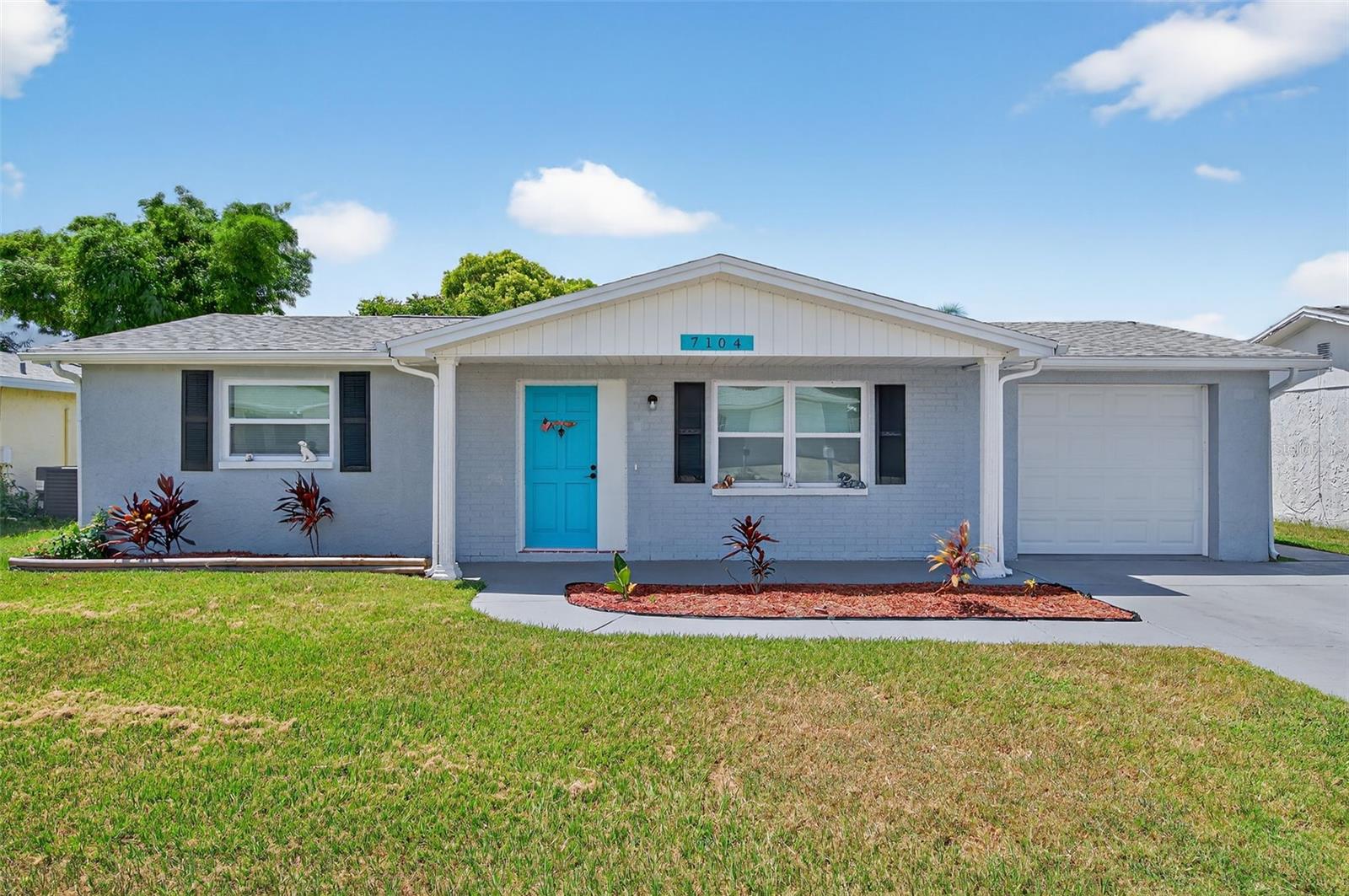 Stunning, new SINGLE FAMILY HOME rental - 3 BR, 2 bath, 1 car garage with FENCED YARD in Port Richey, awaiting its new occupants! COMPLETELY REMODELED with gorgeous MODERN KITCHEN featuring new STAINLESS STEEL APPLIANCES, stone countertops, and wood cabinets. Also beautiful LUXURY VINYL PLANK FLOORING throughout the living spaces and bedrooms, and tile floors in the stylishly UPDATED BATHROOMS, no carpet here! NEW ROOF & WINDOWS give you peace of mind! A cute, covered front porch welcomes you as you step into this OPEN FLOOR PLAN with LIGHT 'N BRIGHT ROOMS and attractive color scheme. The cozy living room opens to the kitchen and dining area. The primary bedroom is at the rear of the home and boasts an en suite bathroom and closet system included. Secondary bedrooms are spacious and just off the hallway from the guest bathroom. An oversized garage gives you plenty of extra storage space. Head outside to your 10x26 OPEN PATIO that overlooks the FENCED BACKYARD, giving kids or pets plenty of room to roam! Just minutes from US 19 and all the shopping and dining in the area, also a convenient drive down Ridge Rd to the Suncoast Pkwy which takes you right down to Tampa International Airport and Downtown Tampa. Fred Howard Park, Honeymoon Island State Park, area beaches, Downtown Dunedin, Safety Harbor, and St Pete are all easily accessible from this great location. Please call today to schedule your private tour!