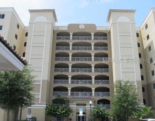 Turkey Lake frontage corner unit, building elevators, largest floor plan in the building. Relax on your huge balcony while enjoying a view of Universal studio fireworks show. Gated community with gym, clubhouse, heated pool and fishing dock