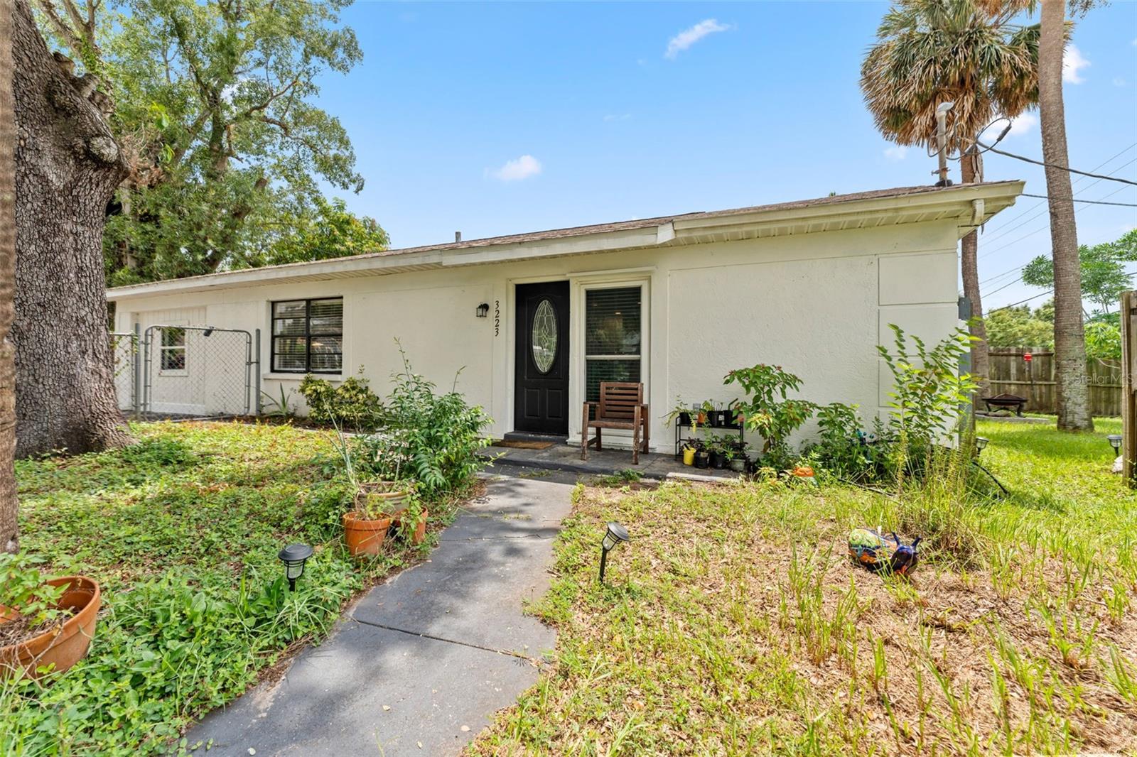 This updated 3-bedroom, 2-bathroom Tampa home blends modern style with a warm, welcoming vibe. The heart of the home is a bright, open kitchen featuring sleek white shaker cabinets, granite countertops, stainless steel appliances, and a spacious island perfect for meal prep or casual dining. The open-concept living and dining area flows effortlessly, with luxury vinyl plank flooring throughout for a clean, low-maintenance look.
The split bedroom layout offers privacy, with a generously sized primary suite complete with an en suite bathroom and ample closet space. Both bathrooms have been refreshed, including stylish tile work and fixtures. Additional bedrooms provide flexibility for a home office, guest room, or creative space.
Outside, a fenced yard offers room to garden, relax, or let pets play. Located just minutes from downtown Tampa, Ybor City, and major highways, you’ll have quick access to dining, entertainment, and all the city has to offer—without HOA restrictions holding you back.
Move-in ready and full of charm, this is a home where style meets convenience.