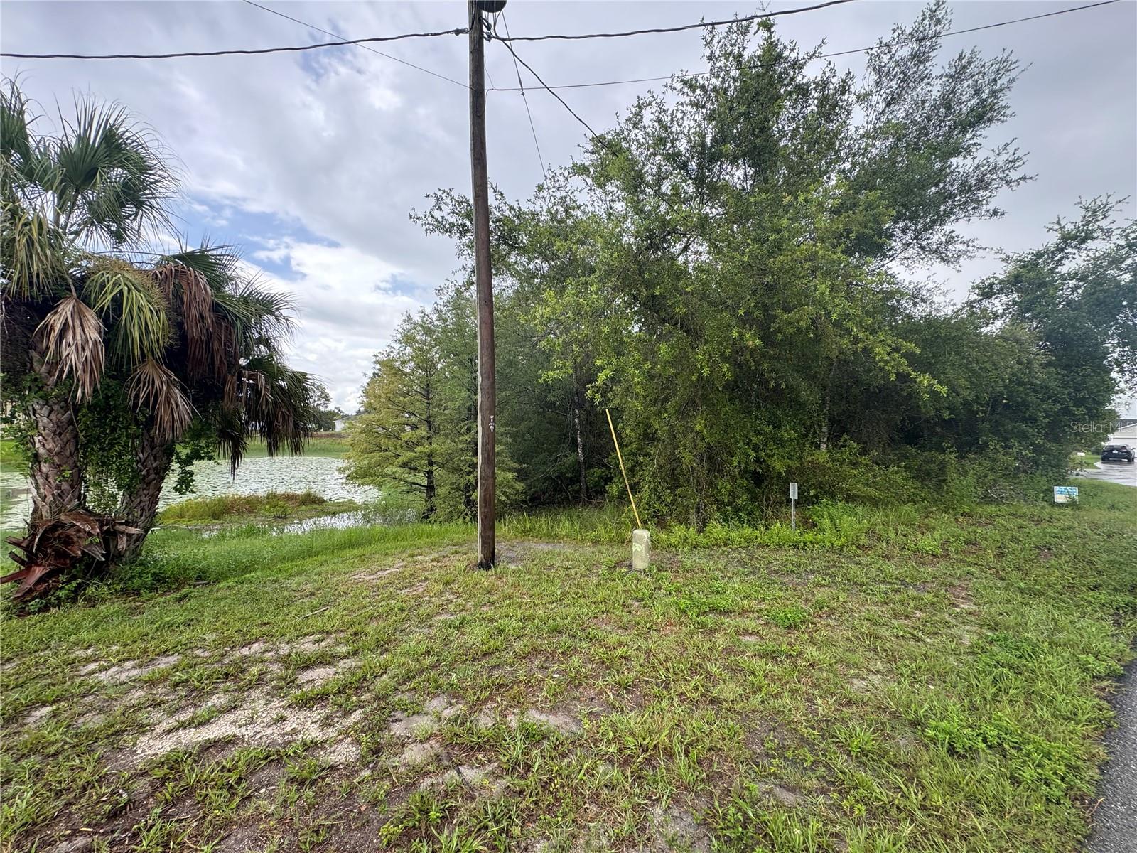 Gorgeous lot to build your new dream home with over half an acre that backs into a private pond! Cul de sac, and dead-end street adds to your peaceful setting! Optional Home Owner's Association $125 year gives use of Park, Boat Ramp, Dock, Tennis court, shuffleboard.