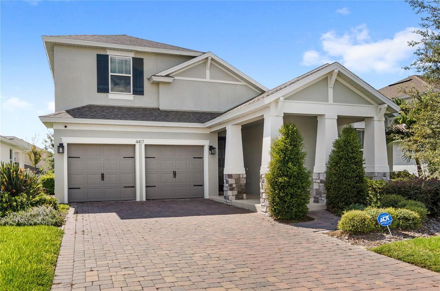 Luxurious 5 bed 3.5 bath home with a generous loft and 2 Car Garage in the highly desired Hartwood Landing community of Clermont. Hartwood Landing features a resort-style community pool and clubhouse, a state-of-the-art fitness center, playgrounds and walking trails. This former model home boasts over $140,000 in upscale upgrades, designed to make every day feel like a luxurious retreat. As you enter, you'll be greeted by a bright and spacious floor plan. Showcasing high-end finishes all throughout like ceramic tile flooring, high ceilings, custom light fixtures, and its modern design. The gourmet kitchen is a chef's dream, equipped with top-of-the-line stainless steel appliances, sleek granite countertops, custom cabinets, beautiful kitchen backsplash, a closet pantry for extra storage, and an expansive kitchen island/breakfast bar. This open concept seamlessly blends with the formal dining room and spacious living room, ideal to interact with family and friends, great for gatherings and entertaining. The bedroom layout provides space and privacy for all. The elegant master suite is a peaceful retreat, located on the first floor, offering a spacious walk-in closet and a spa-like ensuite bathroom with dual vanities, a soaking tub and a step-in shower. Upstairs, you will find a spacious bedroom with a separate full bathroom. Plus the generous loft area can be used as an additional living space, office, or movie room, offering extra flexibility. All the bedrooms have cozy carpet flooring, and the four guest bedrooms boast an ample closet. Three additional guest bedrooms are on the first floor with another full bathroom for ease and comfort. Step outside to the covered patio area, enjoy the fresh air and a quiet evening with views of the beautiful green landscape. For added convenience, this stunning home offers a laundry room (Washer and Dryer Included) and a spacious 2 car garage with a paved driveway for extra parking. With energy-efficient systems, quality construction, and safety features, this home checks all the boxes. Don't miss the opportunity to live in this extraordinary home. Great location, near Kings Ridge Golf Club, Clermont Arts & Recreation Center, just a few minutes to Historic Downtown Clermont and a short drive to Walt Disney World. You will find a range of shopping, restaurants and entertainment options.
