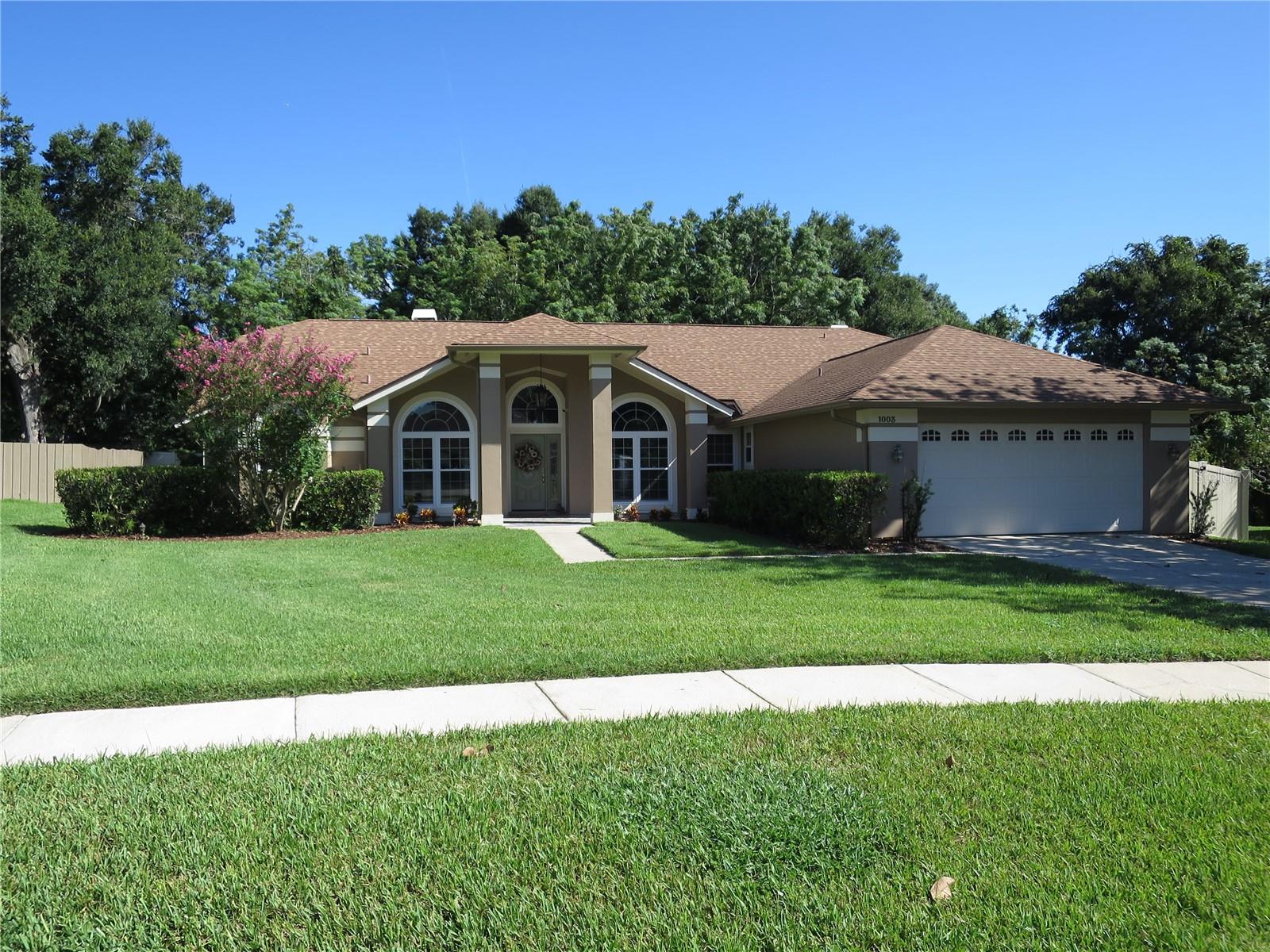 Beautifully well- kept home with loads of upgrades including a new roof in 2019, new energy efficient windows, new faux wood blinds, completely remodeled hall bath, and a new whole house gas generator, all in 2023. In addition, a new vinyl fence in 2020, new gutters and recently painted exterior. This lovely home includes 3 bedrooms plus a home office, formal living and dining areas, and an open family room/kitchen concept. The Spacious 23 x 16 master bedroom has a vaulted ceiling, wood burning fireplace, french doors and more than enough room for a cozy sitting area. The master bath has dual vanities, a separate shower and jacuzzi tub - ready for your own inner designer flair. The vaulted ceilings throughout enhance the home’s natural light and living space. In the family room a gorgeous floor to ceiling wood burning fireplace recently resurfaced with beautiful textured stone. Crown molding frames both the family room and kitchen area. The Eat in-kitchen includes granite counters, a breakfast-nook and breakfast bar. French doors in the family room and breakfast nook area lead to a screened patio overlooking a private back yard. A fabulous premium 1/3 acre pie shaped lot with a huge private backyard - no rear neighbors, plenty of room for a pool. This lovely home is located in Almond Tree Estates, just west of Apopka Vineland Rd., adjacent to Gotha. Walking distance to Gotha Middle School. Don’t miss out. Master bedroom virtually staged.