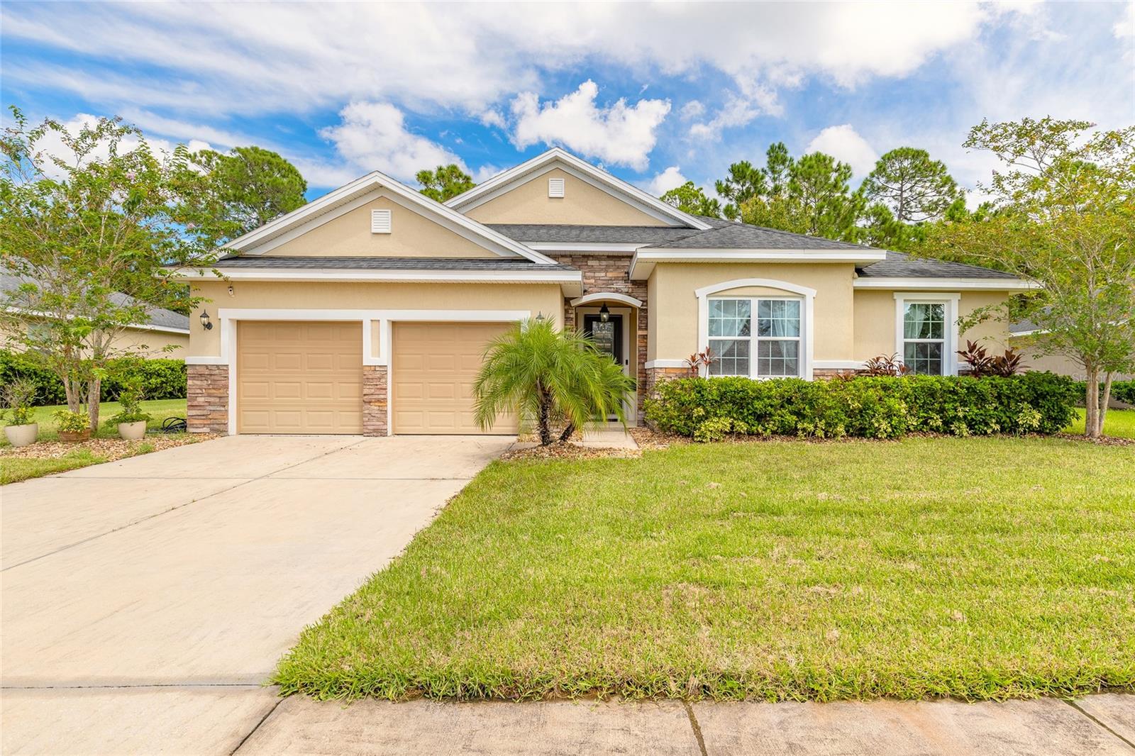 Exceptional Home in Hunters Ridge, within walking distance to highly rated Pathways
Elementary School (14:1 student–teacher ratio), this 2,672 sq ft custom home in the Deer
Creek section blends elegance, functionality, and privacy in one of Ormond Beach’s most
desirable communities. Soaring ceilings & a dramatic chandelier welcome you into a spacious
layout featuring a versatile Dining/bonus room & a flex guest bdrm/den/office with French doors.
The open-concept living, dining, and chef’s kitchen—with granite counters, large island,
stainless appliances, and custom backsplash—flow seamlessly together. The family room is
anchored by a striking stone entertainment wall. The split-bedroom design includes 3 BRs & 2
BAs. The primary suite offers a walk-in closet, double quartz vanities, spa tub, and glass
shower. An interior laundry and abundant storage add convenience. Step outside to your private
oasis with covered porch, custom pavers, tranquil Koi pond, and peaceful conservation
views—no rear neighbors. Hunters Ridge amenities include a clubhouse, two pools, tennis and
basketball courts, ballfields, parks, a fishing pier, and canoe launch. Just 3 miles from I-95 and
minutes to shopping, dining, and Tanger Outlets.