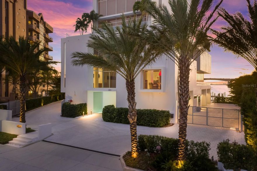 AQUA, a rare & exquisite boutique building comprised of just seven exceptional residences, offers the absolute best in downtown Sarasota waterfront living. Only a select few can experience the ultra-luxe lifestyle of this special property, designed by renown architect Guy Peterson and meticulously built to the latest construction standards. Do you dream of waking up to the sparkling waters of Sarasota Bay, with your own BOAT DOCK (w/16,000 lb. lift) just steps away, and of having the space to simply relax and breathe? Then this 3590 sq' second-floor residence will absolutely wow! With only the finest finishes and a solid feel that is rare in condo living, as well as a vast and unobstructed view of Sarasota Bay, it is a must-see. The location on Golden Gate Point delights with close proximity to all of downtown, while miraculously also offering a quiet neighborhood feel and the charm that comes with it. Approaching the sleek building as an owner, you'll enter via the GATED drive into your own PRIVATE 2-CAR GARAGE, while guests will be impressed with the stylish water-feature-lined front entrance. There is a glorious water view right from the CONCIERGE-STAFFED lobby, setting the scene perfectly. The elevator will whisk you directly to your spacious residence, where the first thing you will notice is the dramatic & expansive water view. You'll soon settle in and appreciate all this spectacular home has to offer; the expansive CHEF'S KITCHEN features abundant storage, a large island with two sinks, a NATURAL GAS gourmet range (a rarity downtown!), and appliances by WOLFE, SUB-ZERO, and MIELE. The sleek kitchen is completely open to the large and well-designed living space, which features a stunning wall of windows and connected - yet defined - living, dining, and lounge spaces. A wall of IMPACT-RATED accordion glass doors open to the terrace, which is also equipped with natural gas for easy grilling. The main bedroom suite features floor-to-ceiling windows overlooking the water (don't worry, Lutron-powered blackout shades are in each bedroom as well!), plus an immaculate closet and serene bath with a shower & clean-lined soaking tub. The floor plan offers two more EN-SUITE bedrooms, also featuring large windows and built-out closets, plus a convenient powder bath. A nice surprise awaits when you exit through the side door to a residential oasis...you'll find yourself in what feels like your own private amenity area! A lounge, executive meeting room, well-equipped fitness center will full water views, a yoga room, private climate-controlled wine storage, a massage room and a relaxing sauna will feel like they are yours alone. Finally, on the ROOFTOP PATIO, all (seven) owners enjoy access to an immense outdoor space with a lounge area and stunning views of the bay, gulf, and downtown. Daily sunset-watching is certainly in your future! AQUA...you must see it to believe that you truly CAN have it all on Golden Gate Point.