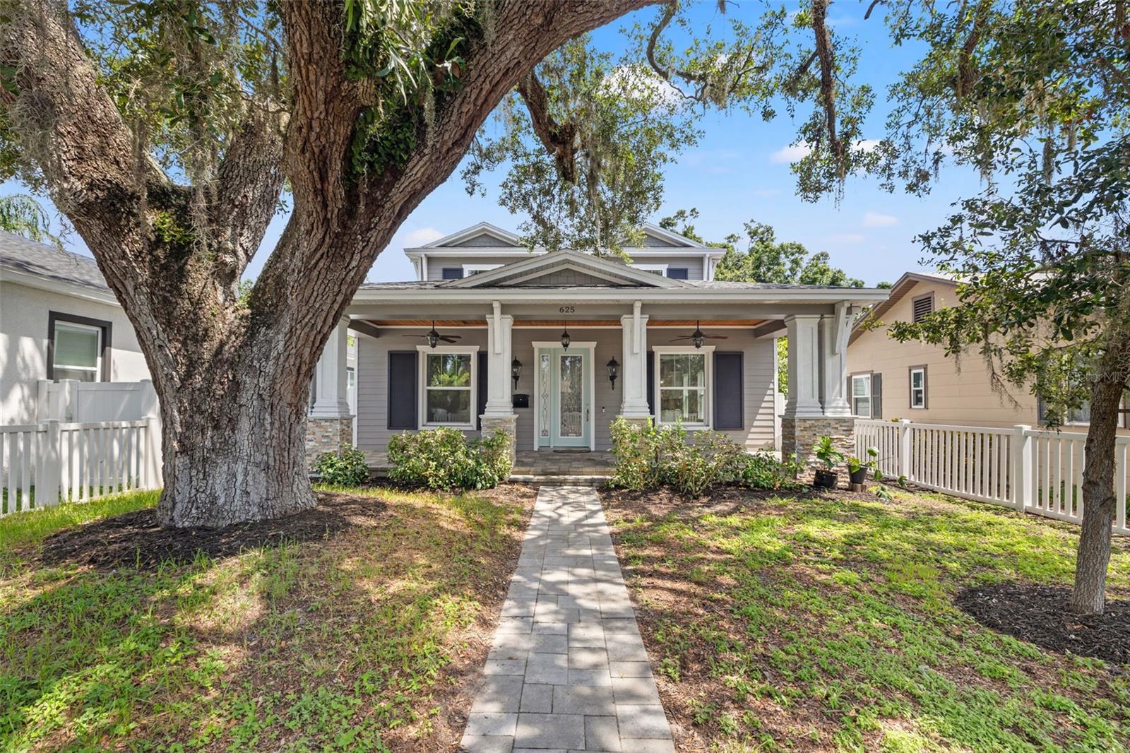 Welcome to this impeccably designed, newer construction home offering the ideal blend of modern luxury, thoughtful design, and central convenience. Boasting 3 bedrooms, 3.5 baths, 2,498 square feet of living space, and an attached 2 car rear entry garage. Nestled in a desirable St. Petersburg neighborhood, this residence places you just minutes from vibrant downtown, with quick access to I-275 for seamless commutes and weekend escapes to the award-winning Gulf beaches. From the moment you arrive, you’ll feel an undeniable sense of comfort and craftsmanship. Step inside to discover a bright, open layout accented by elegant touches throughout—featuring European oak wood flooring, crown molding, and abundant natural light that enhances every corner. At the heart of the home lies a gourmet chef’s kitchen designed for both everyday living and elevated entertaining. Appointed with sleek granite countertops, custom wood cabinetry with soft-close drawers, a KitchenAid appliance package including convection oven, and a striking farmhouse-style sink, this kitchen offers both form and function. A center island with bar seating, built-in microwave, built-in wine storage with cooler, and open metal rod shelving add to its unique charm and utility. An oversized walk-in closet pantry completes the culinary experience. The dining and living room combo on the main level flows effortlessly, creating a warm and connected space for hosting or relaxing. Just beyond is the private primary suite, a true sanctuary with a spacious layout, custom touches, and a barn door entry into the spa-like ensuite bath. Indulge in the luxury walk-in shower, deep soaking tub, dual vanities, and an expansive custom walk-in closet designed with both elegance and efficiency in mind. Upstairs, a versatile loft space awaits—perfect as a home library, game room, or cozy media retreat, complete with custom built-in floor-to-ceiling bookshelves with enhanced lighting. Two generous junior suites provide comfortable accommodations for guests or family, each with access to beautifully finished baths. Additional standout features include: Steel-threaded rod construction for enhanced wind resistance and structural integrity, contemporary lighting fixtures and designer finishes throughout, energy-efficient systems and quality materials that deliver peace of mind, custom built-ins and thoughtful storage at every turn. This home provides the rare combination of newer construction, timeless upgrades, and an unbeatable location—just minutes from downtown St. Pete, trendy dining and shopping, local parks, and the sparkling waterfront. Whether you're commuting to Tampa, exploring the best of St. Pete, or enjoying a relaxing evening in your stylish retreat—this home delivers the ultimate Florida lifestyle.