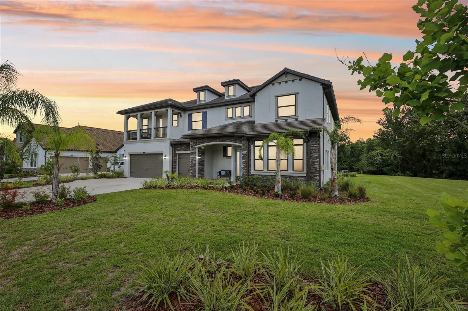 Indulge in an unparalleled lifestyle of elegance and comfort in this MAGNIFICENT 6-BEDROOM, 4.5-BATHROOM ESTATE HOME located in the upscale, gated community of Cordoba Ranch Estates. This NEARLY NEW Ventura model was built by WCI Homes in 2022 and delivers unparalleled comfort and luxury.
As you step through the grand entrance, you are greeted by 20-FOOT CEILINGS AND A SWEEPING STAIRCASE. The dramatic yet sophisticated design including graceful arched doorways, and an open-concept floor plan create a premium living experience. Entertain with ease in the LARGE FORMAL LIVING AND DINING ROOMS, accentuated by ELEGANT TRAY CEILINGS AND ABUNDANT NATURAL LIGHT. A well-appointed BUTLER'S PANTRY, INCLUDING A GENEROUS DRY BAR AND CHEF’S DREAM WALK-IN PANTRY, seamlessly connects the gourmet kitchen to the formal dining room, ensuring flawless service for your dinner parties.
The stunning, HIGH-END KITCHEN is a masterpiece of both style and function. PRISTINE WHITE CABINETRY is perfectly complemented by BRUSHED NICKEL HARDWARE, GLEAMING QUARTZ COUNTERTOPS, AND A LARGE APRON SINK. Every detail has been thoughtfully designed including SOFT-CLOSE DRAWERS AND A CRISP WHITE TILE BACKSPLASH THAT EXTENDS UP TO THE CEILING. The EXPANSIVE CENTER ISLAND, WITH COMFORTABLE SEATING FOR SIX, is ideal for casual meals and lively conversations. A SECONDARY DINING ROOM OFF THE KITCHEN, WITH TRIPLE SLIDERS leading outside, offers a bright and inviting space for everyday meals.
Two spacious bedrooms, both with walk-in closets, are conveniently located on the main level. The large laundry room is a model of convenience, featuring ample countertops, a sink, and generous cabinetry.
Ascend the staircase to discover a private haven of relaxation and recreation. Host unforgettable movie nights in the SPACIOUS THEATRE ROOM, where you can create lasting memories with family and friends, then step out onto the ADJOINING BALCONY to unwind and enjoy the fresh air together.
The primary suite is a true retreat, BOASTING PRIVATE ACCESS TO A COVERED BALCONY, A PRIVATE DRESSING ROOM WITH TWO LARGE WALK-IN CLOSETS, AND A SPA-LIKE ENSUITE BATHROOM. Unwind in the GARDEN TUB OR THE WALK-IN SHOWER, COMPLETE WITH DUAL SHOWERHEADS AND A FRAMELESS GLASS ENCLOSURE. One of the three additional upstairs bedrooms includes its own private ensuite bathroom, while another full bathroom serves the remaining bedrooms. A DEDICATED OFFICE WITH A DISTINGUISHED COFFERED CEILING offers the perfect work-from-home sanctuary.
Step outside to the EXTENDED COVERED LANAI overlooking the expansive back and side yard, offering a blank canvas for your dream pool and outdoor kitchen.
Living in Cordoba Ranch Estates extends beyond your property line with a fabulous community amenity center. Enjoy resort-style living with a BEACH-ENTRY SWIMMING POOL, A KID-FRIENDLY SPLASH AREA, AND A PLAYGROUND AND PICNIC AREA. Stay active with BASKETBALL, RACQUETBALL, AND TENNIS COURTS.
While this home offers a peaceful, secluded feel, you’ll enjoy the convenience of being just MINUTES FROM TOP-TIER HOSPITALS like Moffitt Cancer Center, the VA Hospital, and Advent Health. A wide variety of DINING AND SHOPPING OPTIONS ARE ALSO NEARBY, and you’re only a short 30-MINUTE DRIVE FROM TAMPA INTERNATIONAL AIRPORT AND VIBRANT DOWNTOWN TAMPA.
