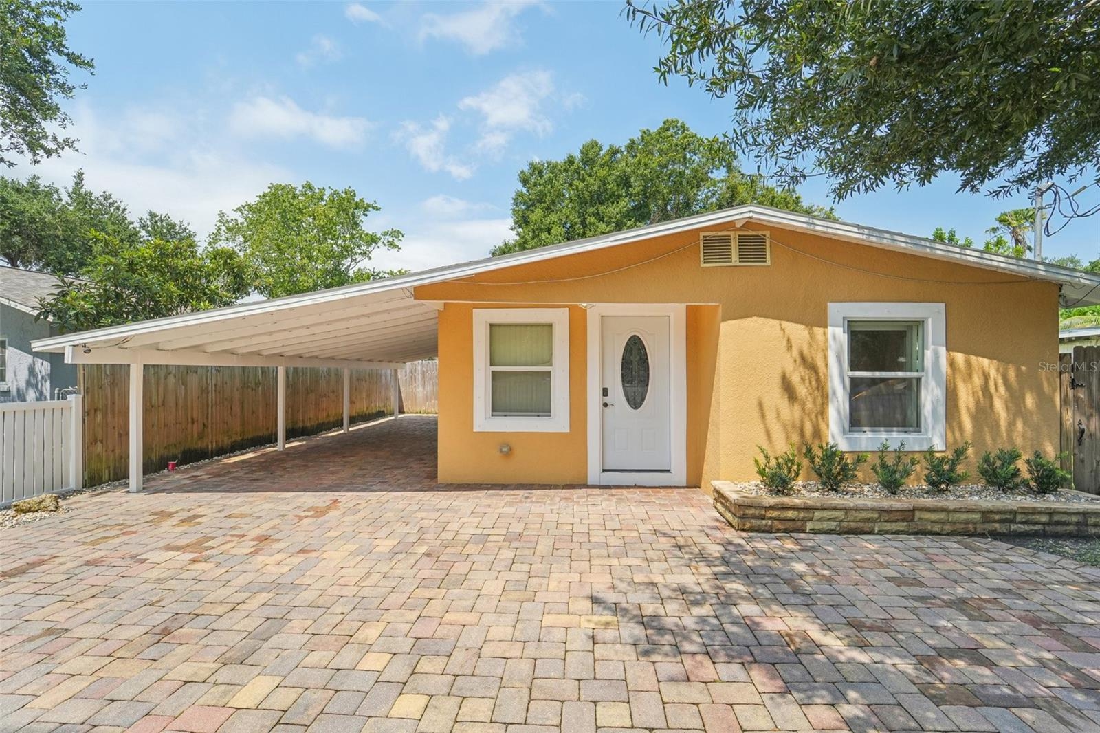 Welcome to 3512, a charming 2-bedroom, 1-bath home featuring an added bonus room with a laundry area. The expansive, fully fenced backyard is ideal for entertaining and outdoor activities, while the front yard offers ample parking space. This home has been carefully maintained, with significant updates including a complete roof and flooring replacement, new landscaping, and consistent upkeep. Located just a short drive from vibrant shopping districts, serene beaches, and the scenic Riverwalk along the Manatee River leading to downtown Bradenton's culinary delights, this property offers an exceptional opportunity with no deed restrictions, HOA, or CDD fees. Competitively priced to sell—schedule your private showing today!