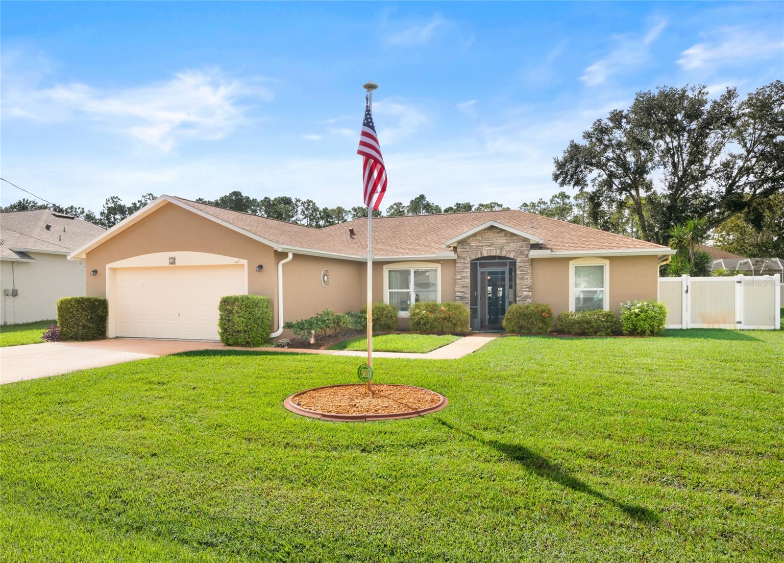 Discover this beautifully maintained home in the desirable Pine Grove neighborhood of Palm Coast, showcasing exceptional upgrades and energy efficiency with 24 owned solar panels and a 2021 roof. Spanning close to 2,000 sq ft, the residence offers elegant tile and laminate flooring throughout, marble windowsills, and 120 mph Low-E hurricane glass windows for peace of mind. The updated kitchen features soft-close cabinets with pull-outs, granite countertops, a farm sink, under-cabinet lighting, skylights for added natural light, and brand-new stainless appliances (2025). The guest bathroom also enjoys the benefit of a skylight, creating a bright and welcoming space. Ceiling fans are thoughtfully placed throughout the home to enhance comfort, and convenient pocket doors lead to the inviting Florida room, perfect for relaxing or entertaining. Enjoy Florida living at its finest with a heated salt-water pool, screened and tiled double lanais, and a cozy firepit, plus a beautiful Florida room overlooking the peaceful pool setting. Additional highlights include a Culligan whole-house water filtration system (owned), deep-well irrigation, a two-toned vinyl fenced yard, generator transfer hookup, and tasteful stone accents with landscape curbing. With the owned solar panels, the average electric bill is just $113 per month, offering significant long-term savings. This home combines style, comfort, and efficiency in one exceptional package.