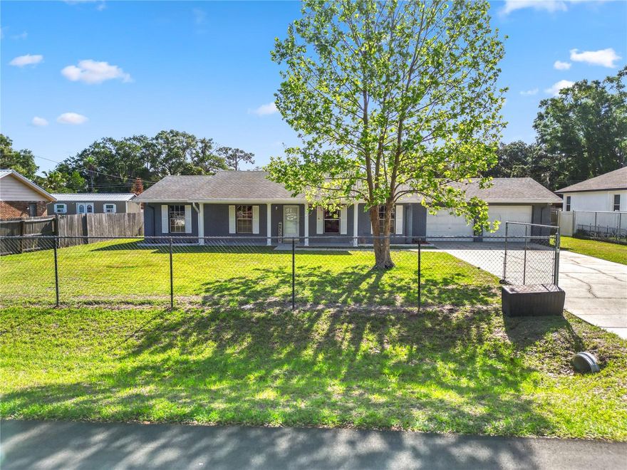 One or more photo(s) has been virtually staged. SOLAR HEATED SALT WATER POOL HOME + FULLY GATED + 10 X 30 AIR-CONDITIONED WORKSHOP 1000 sq ft with remote opener+ TWO BAY 2.5 CAR 600 sq ft GARAGE with a separate Central HVAC--TWO HVACs--NO HOA! RARE FIND! EXCEPTIONAL VALUE for everything included! Priced to make this one of the BEST BUYS ON THE MARKET. WELCOME to the home you have been waiting for! CHECKS ALL THE BOXES! This 3-bedroom, 2-bath pool home sits on a fully gated property, offering the perfect blend of comfort, security, and space to truly enjoy your lifestyle. Buyer Bonus Opportunity: Seller is offering flexibility—choose your preferred flooring color and have it installed prior to closing OR take advantage of a seller concession and customize it your way! The interior offers a spacious and inviting layout featuring a large living room perfect for relaxing. The kitchen flows seamlessly with a breakfast bar and dining room combo, creating an open and functional space for everyday living. A convenient pass-through window connects the kitchen directly to the pool and lanai, making outdoor entertaining effortless. The primary suite is a private retreat, complete with its own direct access door leading to the pool and backyard—perfect for enjoying peaceful mornings or evening swims. Step outside to your own backyard oasis featuring a sparkling saltwater pool--softer on the skin, lower maintenance, and perfect for all. The expansive pool cage with THREE access doors creates seamless indoor-outdoor flow and makes hosting guests a joy all year-round. Separate patio area for your grill! Need extra space? This property delivers with a 10x30 electric, air-conditioned workshop shed—perfect for a gym, hobbies, storage, a home business, or a creative studio.  CALLING ALL Car enthusiasts, hobbyists, or those needing extra space will love the 2.5-car garage with two bay doors, providing ample room for vehicles, storage, golf carts, or a workshop setup. Enjoy the convenience of an OVERSIZED DRIVEWAY AND GARAGE SET UP, offering space for up to 8 vehicles depending on size—perfect for guests, toys, or multiple drivers.This home offers the freedom, function, and flexibility today’s buyers are searching for—whether you’re relaxing poolside, working on projects, or enjoying the privacy of your gated space. This is more than a home—it’s the lifestyle you have been looking for! Call today to tour this great opportunity!