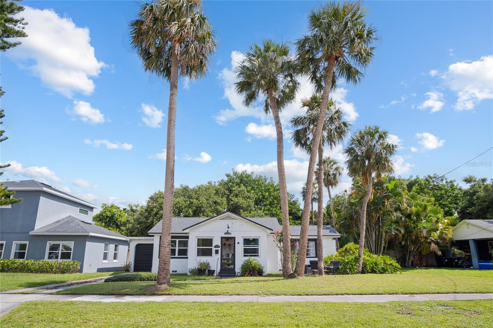 Charming Bungalow on Double Lot Near Lake Killarney!  Welcome to this delightful 3-bedroom, 2-bathroom bungalow nestled on a generous 0.32-acre lot—one of the largest in the neighborhood—just one block from scenic Lake Killarney. With a spacious backyard, mature landscaping and even a shuffleboard court. This property offers a rare opportunity to create your very own backyard retreat. There's room to add a pool, a pickleball court, or simply enjoy the expansive green space as is.  Inside, the home showcases classic charm with timeless features such as curved archways, warm wood floors, and a layout that flows with ease. The kitchen features granite countertops and plenty of space for preparing meals, while the surrounding living and dining areas offer inviting spaces for relaxing or entertaining.  The same homeowner for 26 years because of the love for the home offering a blend of character, comfort, and convenience. Located just minutes from Park Avenue, College Park, and Downtown Orlando, with easy access to I-4, 17-92, and a host of restaurants and shops, you'll enjoy both serenity and connectivity.  Take a stroll down the sidewalk to the lake or envision your next gathering in this incredible backyard. Homes like this don’t come along often—schedule your showing today and imagine the possibilities!