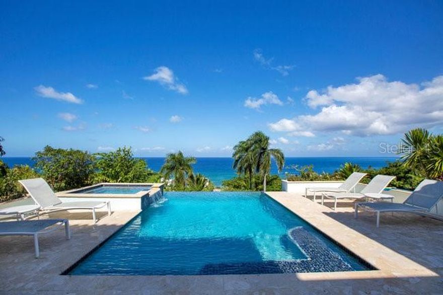 Paradise Found!!  Welcome to Tranquilo, an extraordinary five-bedroom luxury villa perched on a quiet cliffside in the heart of Rincón, offering breathtaking ocean views and the ultimate in Caribbean elegance.

Designed in an open courtyard style, this exceptional residence blurs the line between indoor and outdoor living. At its center, a vanishing-edge pool appears to flow directly into the sea, creating a seamless connection to the horizon. The villa is just 350 steps from the beach and Rincón’s world-famous surf breaks, offering easy access to sand, surf, and sunsets.

Every detail of Tranquilo showcases custom craftsmanship and thoughtful design, from its refined finishes to the artful integration of natural materials. Expansive terraces and open living spaces capture ocean breezes and frame stunning views—perfect for whale watching during migration season or entertaining against the backdrop of fiery Caribbean sunsets.

Located on a quiet, private street, yet just minutes from Rincón’s vibrant dining and surf scene, Tranquilo embodies the ideal blend of luxury, serenity, and tropical lifestyle.