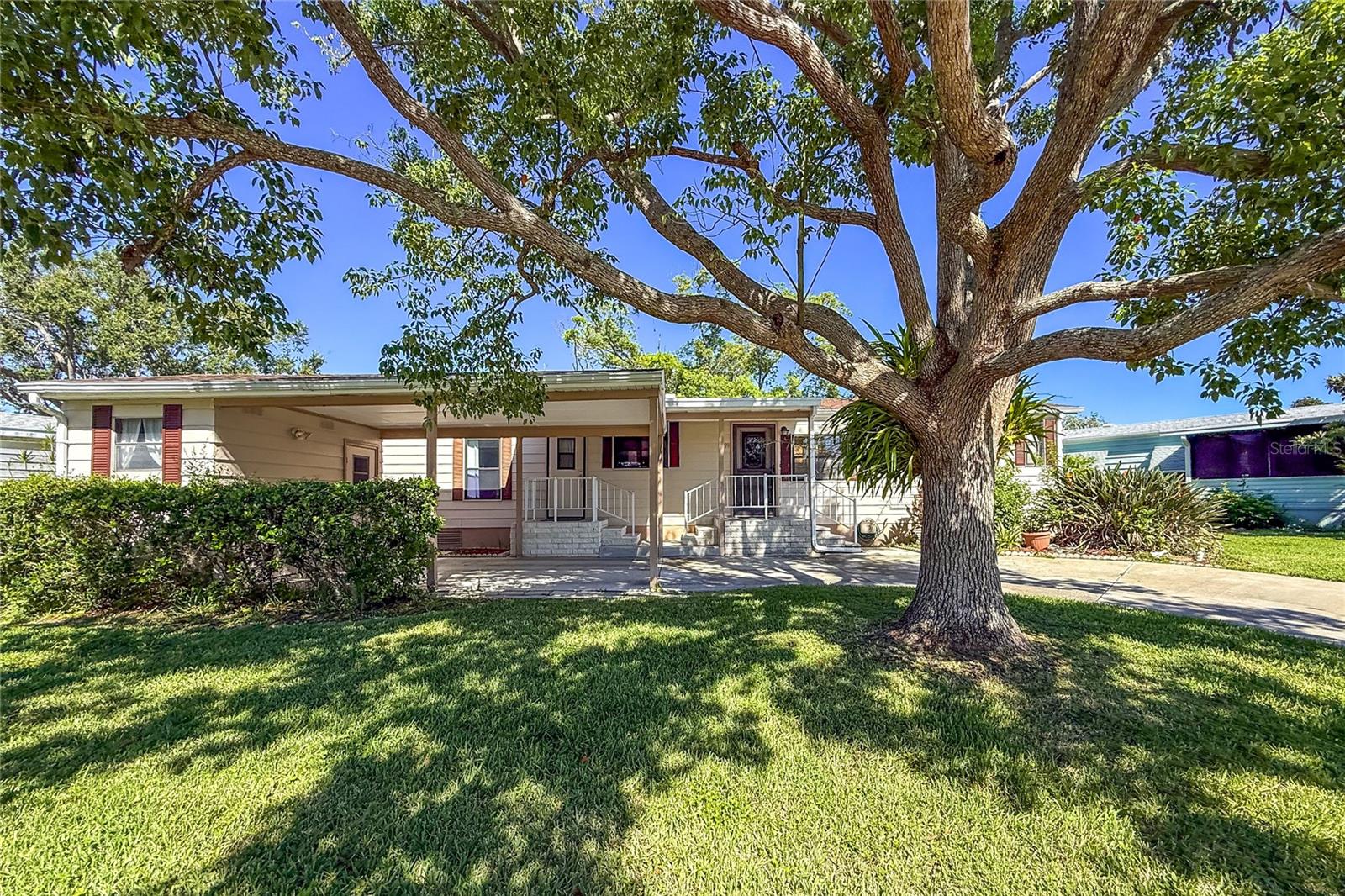 Beautiful 2/bd, 2 ba split floorplan home with a very rare bonus room for a 3rd bedroom, craft or office. Located in the 55+ commuity of Ridgewood Meaddows this home is located on a quiet street with a large carport and storage/workshop. A new AC unit was installed in 2022 and a new roof in 2025. Refrigerator and dishwasher have been recenlty installed and the kitchen has lots of cabnets for storage. This is a large home with over 1,400 sq. ft. of heated living space. The 55+ Ridgewood Meadows community features a beautiful clubhouse, pool, spa, tennis courts, pickle ball courts, shuffleboard and an outdoor fitness area. This community is also golf cart and small pet friendly. Ridgewood location has close access to I-75, many restaurants, the Ellenton Outlet Mall, the Manatee County Library. Ridgewood Oaks provides 24 hour gated security and lots of planned community activities to enjoy. All room sizes are approximate. All information is deemed reliable but should be verified by buyers and/or buyer's agent.