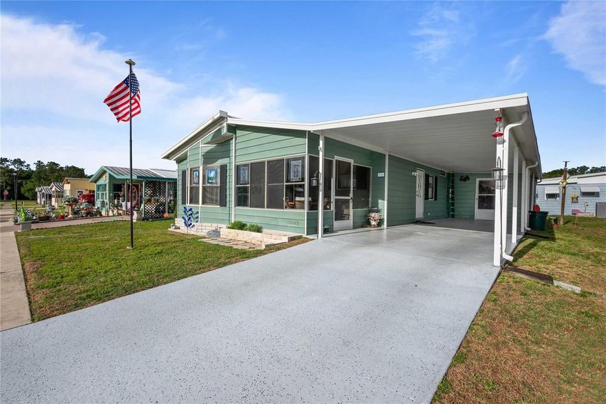 Welcome to Terrace Park, a desirable 55+ community where you own the land! This well-maintained home offers numerous updates and features throughout. The metal roof has recently been serviced. The plumbing has been upgraded to PEX, providing added peace of mind. The kitchen features upgraded cabinetry, laminate flooring, and newer appliances—making it both functional and stylish. The dining area includes built-in cabinets and flows seamlessly into the spacious living room, creating an ideal space for entertaining. Enjoy your morning coffee in the inviting Florida room at the front of the home, or relax in the front screened room while taking in Florida’s warm winter breezes. The primary bedroom is privately located at the rear of the home and offers a large en-suite bathroom along with an impressive walk-in closet. The second bedroom is generously sized and includes built-in closets for ample storage. The hall bathroom features a tub along with an updated sink and toilet. Convenient laundry is located just off the carport In the 8x10 attached building and new buklding was added to the back of the home for even more storage space.  Outside, you’ll find a covered double carport with tandem parking, providing ample space for vehicles and guests. For added comfort and peace of mind, a new AC and duct work was installed in 2023. Schedule your private tour today—this one won’t last!
