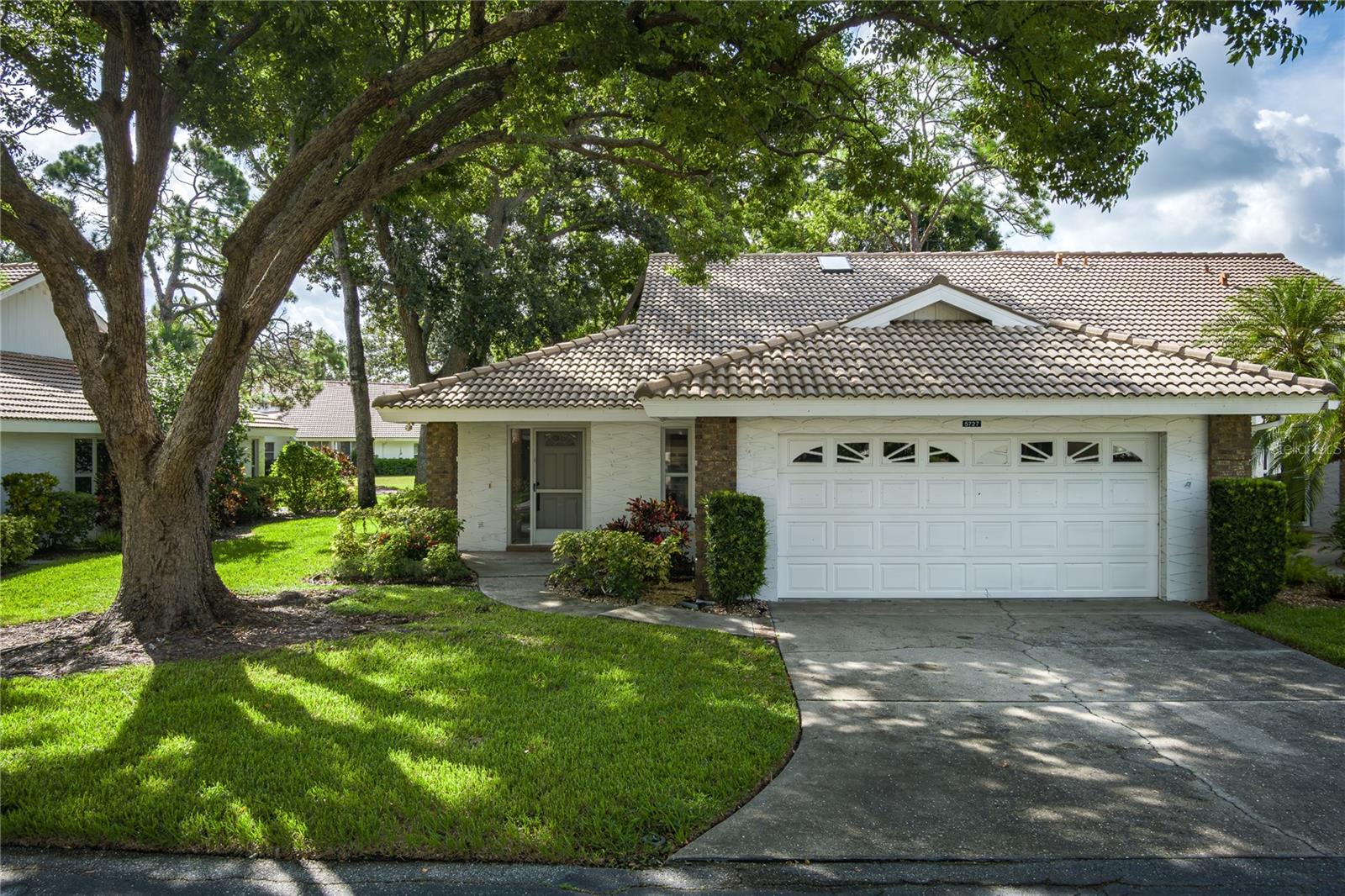 Discover the potential in this 2-bedroom, 2-bathroom home located in the welcoming 55+ community of Garden Lakes. The spacious open layout features a split-bedroom floor plan, fresh interior paint, brand-new carpet, and updated tile in the Florida room. Enjoy peaceful views of mature oaks and tranquil ponds right from your sunroom—an ideal place to relax and unwind. The primary suite offers a large walk-in closet, and the dining area just off the kitchen provides a comfortable space for meals and gatherings. You'll also appreciate the 2-car garage with its own dedicated laundry area for added convenience.
Garden Lakes offers an active and engaging lifestyle with amenities including a heated pool, fitness center, tennis, pickleball, and shuffleboard. Join neighbors for clubhouse events, card games, jam sessions, or karaoke nights—or take it slow with yoga, crafting, or time spent in the library. There's something for everyone here.