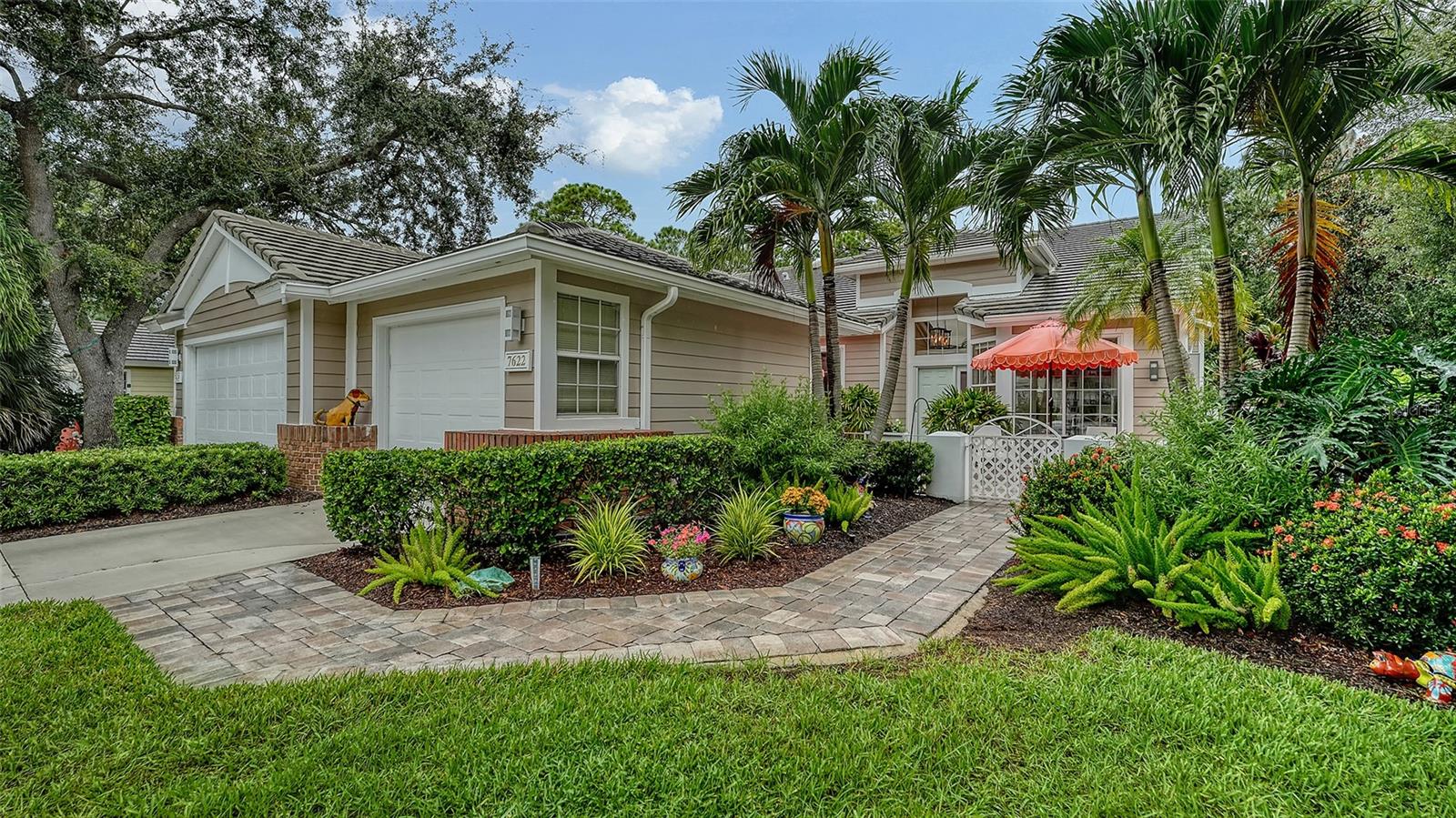 This move-in ready, updated, and impeccably maintained 2-bedroom, 2-bathroom villa with a den and 1-car garage featuring custom built-ins is located in the award-winning University Park Country Club. Offering the open Hibiscus floor plan, the home sits on a premium lot with landscaped privacy along the back and side, creating a tranquil and inviting setting.
A beautifully landscaped yard and welcoming courtyard lead to the front entrance, which features a retractable screen door, glass sidelight, and transom windows. Inside, the hallway’s architectural details open into a bright and airy main living area, where newer luxury vinyl plank flooring flows throughout most of the home. The RENOVATED eat-in kitchen is both stylish and functional, with granite countertops, a tiled backsplash, a raised breakfast bar and a counter-height bar with seating. Recessed and under-cabinet lighting add warmth, while a double slider opens to a private patio with a gas hookup for grilling. The kitchen also features a REFRIGERATOR new in 2022, along with a WASHER & DRYER replaced in 2023.
The open living and dining room combination extends into an all-weather room through new hurricane-rated triple sliders, which then open to a screened lanai and outdoor stone patio. This seamless flow of indoor and outdoor living spaces captures the essence of Florida living.
The spacious primary suite offers a private sitting area and a RECENTLY RENOVATED ensuite bathroom, complete with dual sinks, a zero-entry walk-in shower, and a large walk-in closet with a custom storage system. The guest suite feels like a retreat, with its own double slider leading directly to the courtyard and access to a bathroom with a tub and shower combination. The den or office features custom built-in shelving and desk, along with double sliders that also open to the courtyard, making it a bright and functional workspace.
ROOF replacement in 2016, HOT WATER HEATER in 2023 and a whole-house Generac 18 KW GENERATOR in 2025 offer continuous peace of mind.
Whitebridge Court is a sought-after neighborhood within University Park Country Club, celebrated for its maintenance-free lifestyle, community pool, and proximity to the Club’s amenities.
This villa combines comfort, thoughtful updates, and timeless appeal in one of Sarasota’s most desirable gated communities.
University Park Country Club is consistently ranked one of the top courses in Florida featuring 27 holes of championship golf; tennis and pickleball; fitness center, croquet – as well as an array of social and group activities. Just a short drive outside this peaceful enclave is downtown Sarasota, with shopping, arts & theatres, museums, dining and entertainment, top-ranked healthcare, beaches and SRQ International Airport.