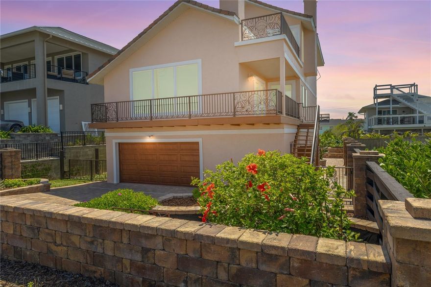 100K UNDER APPRAISED VALUE,PRICED TO SELL!!  Welcome to your coastal dream retreat—an exquisitely remodeled direct oceanfront residence in the coveted no-drive Bethune Beach community, where modern luxury meets relaxed beachside living. This stunning 3-bedroom, 3.5-bath home offers private beach access, panoramic ocean views, and a lifestyle of effortless coastal elegance. Situated on a rare double lot that spans from South Atlantic Avenue to Turtlemound Road, the property includes a deeded private walkway to the beach, a fenced backyard with gated rear access ideal for RV or boat storage, and room for a pool and hot tub. A pet-friendly yard, kayak stand, and storage shed add functionality to outdoor living. The main living space on the second floor showcases soaring two-story vaulted ceilings and breathtaking ocean views, complemented by a gourmet kitchen with custom wood cabinetry, quartz countertops, stainless steel appliances, and a walk-in pantry. A modern gas fireplace with a quartzite surround adds warmth and ambiance, while Italian stone flooring exudes elegance throughout the main level. Also on this floor is a spacious laundry room with a flex space for an office or craft nook, a guest bedroom, and a half bath. The private guest suite on the first floor is perfect for visitors or multigenerational living, offering a bedroom, full bath, and a living area with kitchenette. On the third floor, the luxurious primary suite is a serene sanctuary with its private balcony offering sweeping ocean vistas, a cozy gas fireplace, a walk-in closet, and a spa-like ensuite with upscale finishes. *Property is protected from flooding by  extensive  French Drain System. No  flooding experienced during  Hurricanes Nicole,Ian or Milton.*PER SELLER  Enhancements include a three-stop elevator, impact windows and doors, a new garage door (2024), dual HVAC systems (2020 and 2021), a new water heater (2022), a whole-home surge protector (2024), plantation shutters, motorized shades, Trex decking, custom aluminum railings, and professional landscaping with irrigation. Ideally located just a mile from JB’s Fish Camp and two miles from the Canaveral National Seashore boat launch, this home also offers easy access to nearby parks, recreational spots, and vibrant local culture. Enjoy starlit nights, rocket launches from your balcony, world-class surfing and fishing, and the gentle presence of dolphins and manatees in the nearby Indian River—all with no HOA restrictions. This is the ultimate blend of luxury, location, and lifestyle. Schedule your private showing today—this exceptional home won’t last long.  Seller will consider partial financing. All information is deemed accurate but should be verified by buyers and their agents.