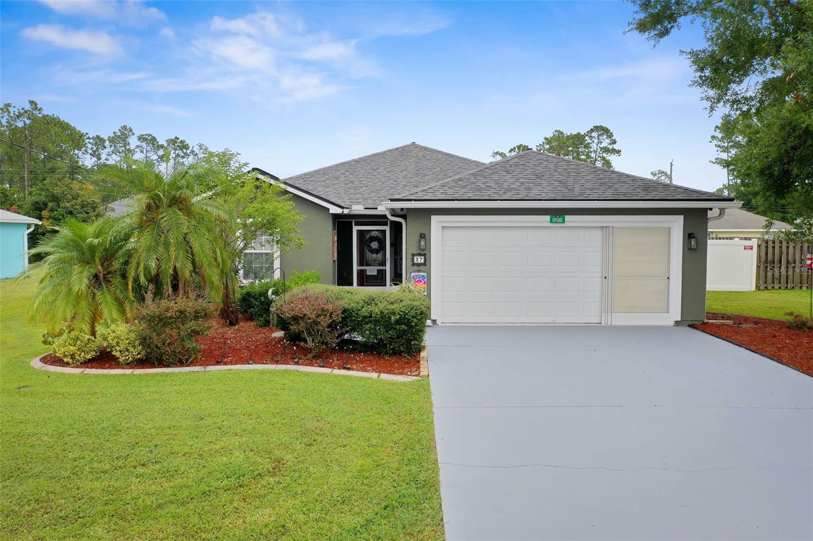 27 Ridley Lane in the Lehigh Woods community of Palm Coast is a beautifully updated 3-bedroom, 2-bathroom home offering 1,534 square feet of living space. Featuring a new roof (2022), high vaulted ceilings, and luxury vinyl plank and tile flooring throughout, this move-in-ready home blends modern style with lasting comfort.
The kitchen is designed for both function and style, complete with quartz countertops, a butcher block coffee bar, stainless steel appliances, and two pantries for storage. Both bathrooms are upgraded with quartz countertops as well. French doors off the dining room open to a screened-in patio with dual sun shades, ideal for relaxing or entertaining. Outside, a pergola with a heated hot tub (available for purchase) and string lights creates the perfect backyard retreat. The large backyard also has plenty of room to add a pool.
Additional features include a 2-car garage with a garage screen, providing comfort and flexibility. Located close to top-rated schools, shopping, dining, golfing, and recreational trails, this property also offers easy access to I-95 and is just minutes from the sandy shores of Flagler Beach.
This Palm Coast home for sale is the perfect combination of location, updates, and lifestyle. Schedule your private tour of 27 Ridley Lane today!