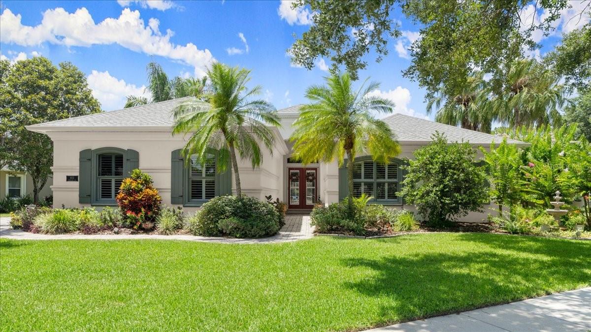 Custom crafted Johnson built pool home in Port Orange's most coveted neighborhood of Town Park. Known for their quality of construction, local reputation, attention to detail, and built-in ''safe room,'' the Johnson Group constructed this concrete block masterpiece in 2003 on the most beautiful lakefront lot in the neighborhood. The landscaping alone on this 0.24-acre lot would take a lifetime to replicate! Solar heated pool, solar water heater, 2021 roof, whole-home gutter system, paver driveway and walkup, buried propane gas tank, built-in surround sound, crown molding throughout, volume ceilings throughout (yes, even the bedrooms!) plantation shutters throughout, 8-ft solid core decorative interior doors, central vacuum system, NO flood history and NO flood zone! Enter through double glass doors into the foyer overlooking the great room with soaring volume tray ceilings and sliding glass doors to the covered lanai and pool area. Covered lanai has plenty of room for everyone
and can be accessed by both the great room and family rooms. With two living spaces, a split bedroom floor plan, and dedicated office, this executive-level home has everything you could possibly need! Kitchen was carefully designed with functionality in mind with GE Monogram gas stovetop with griddle top and electric double oven, custom range hood, granite countertops, 42" Maplewood cabinetry with crown molding, built-in GE fridge, built-in wine fridge, and ample sized food pantry. Kitchen has an expansive view of the pool & lake and overlooks the breakfast nook and family room that offers beautiful coffered ceilings and plenty of natural light. Primary suite encompasses the entire West end of the home and has gorgeous tray ceilings, TWO walk-in closets, built-in poured concrete and steel framed SAFE ROOM, separate linen closet, soaking tub with tile-surround, walk-in shower with bench seating, his-and-hers vanities, and separate water closet. Primary also offers access to the pool area through sliding glass doors. Two guest bedrooms, full bathroom, half bathroom, dining room, and dedicated office/den are all located opposite the primary. Inside laundry room has ample storage, built-in sink, and built-in clothes hanging space. 3-car side entry garage is just beyond the laundry room and has ample built-in storage as well. Entire property is irrigated and is on an electric timer located in the garage. Town Park is an extremely desirable and coveted neighborhood in Port Orange, FL and has a low HOA fee of only 953 per YEAR! Sidewalks throughout, tree-lined streets, regular community events, and so much more. This home was built to last forever and is ready to welcome a new family. You absolutely will not be disappointed, as this one has something to offer every which way you look!
All information and room sizes are intended to be accurate but cannot be guaranteed. Buyers and agents are always encouraged to perform due diligence.