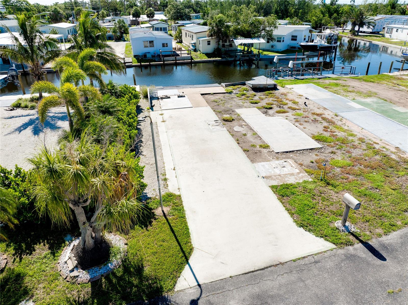 WATERFRONT LOT -Venice Bay Adult Park 55+community own your own land. Don’t miss this rare opportunity to own a prime waterfront lot in a serene community with direct open water access to the Gulf. This lot is 2907 sq ft and features approximately 43 ft with cement seawall
perfect for your dream coastal getaway or mobile home retreat. Enjoy the Florida lifestyle with low maintenance fees of just $475.00 quarterly, which include water, sewer, lawn care and trash removal. Whether you’re boating, fishing, or simply relaxing by the water, this lot offers the perfect combination of affordability and location. Enjoy the nearby, public beaches, golf courses, fishing, biking on the Legacy Trail, downtown restaurants and cafes, shops and performing arts center.