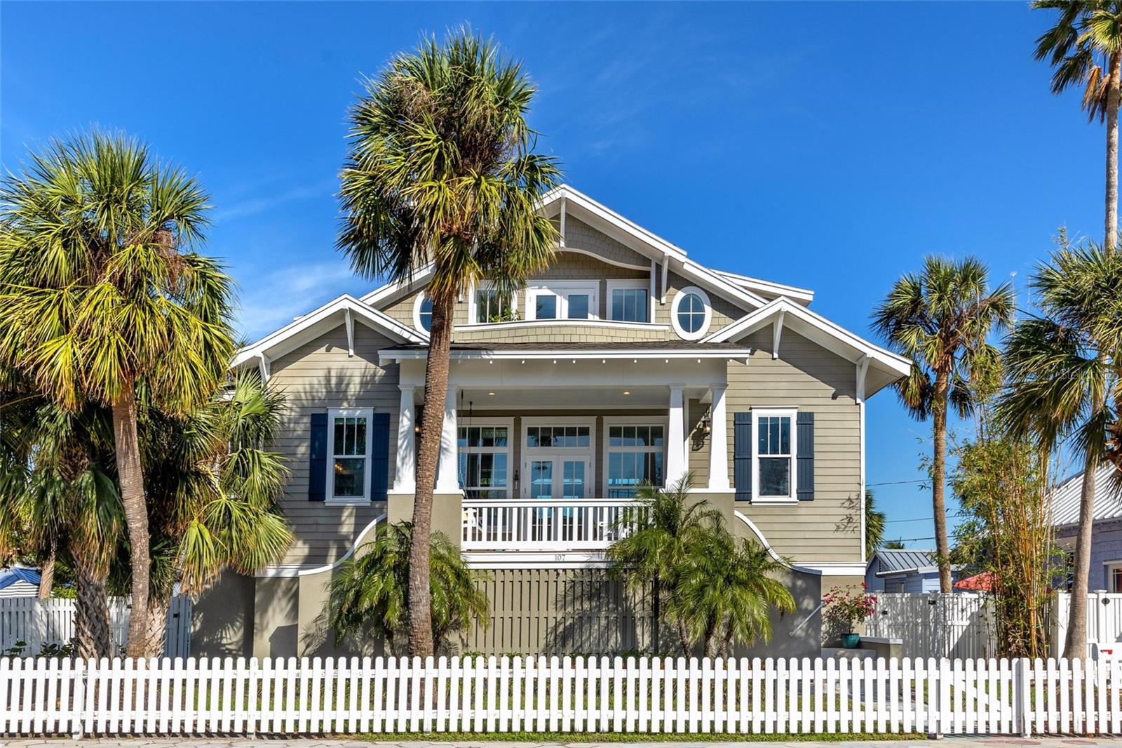 New Price! Location! Location! Location! First time ever on the market! Welcome home to the charming beach town of Historic Pass-a-Grille Beach, Florida!! Located at the southern most tip of St Pete Beach, Pass-a-Grille is famous for its relaxing vibes, white sand beaches on the Gulf of Mexico, beach boutiques, and restaurants. This gorgeous custom coastal home was built in 2016 by a renowned local builder. This lovely home combines a luxury aesthetic with all of the modern conveniences the most discerning homeowners would desire. It occupies an oversized lot on a one way street directly across from a park. You will love being able to only have a short walk to the beach and everywhere else! This 3 story elevated home features 3 bedrooms, 2.5 bathrooms, 3 car garage and 2,286 feet of living space to enjoy. Floor plan is open, spacious and perfectly laid out. The light and bright interior oozes high end craftsmanship that is visually stunning yet comfortable. This home literally could be on any cover of Coastal Home magazine! The second story floorplan includes the open living room with fireplace and custom built-ins, gourmet kitchen, dining area, balcony with swing and water views, covered patio, guest bathroom, laundry room and 2 guest bedrooms. The kitchen features endless quartz counters, stainless steel appliances, gas stove, soft close wood cabinetry, breakfast bar and built-in desk. You will love the adult-sized bunk beds in guest bedroom 2! The third floor is all master suite with multiple closets, 2 balconies including a firepit and water and park views. The master suite also enjoys a bonus room with a coffee bar and open space for yoga, relaxing, etc.! The master bath is perfectly designed with a walk-in shower, soaking tub, dual vanity and makeup space, all with quartz counters. The backyard oasis features a sparkling swimming pool with a spillover spa, pavered patio, garden area, and a designated dog run with artificial turf. You will enjoy the 3 car tandem garage, lots of storage space and plenty of parking. Pass-a-Grille also has a dog park, dog beach as well as pickleball, tennis and basketball courts just a short walk away! Also in the neighborhood is a Marina and a public boat ramp. This is truly a No Brainer...A Gorgeous Home in a highly desirable beach town in paradise! Make your Move!!