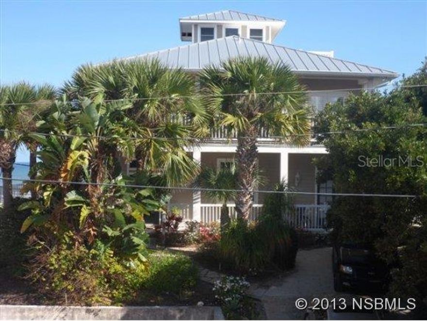 Spectacular direct oceanfront home features great views of the ocean & beach. Custom built in 2002, this 4BR/3BA home has spacious balconies on 3 levels to enjoy the breeze & hear the waves. Top of the line quality throughout, inc. wood floors, high ceilings w/crown molding, built in shelves & cabinets around the magnificent FPL, built in china cabinets in DR, gourmet kitchen w/pantry, breakfast nook, granite, tons of cherry wood cabinets, plantations shutters, luxurious baths & more. Oceanfront balcony off MBR is 34x12, foyer is 10x8, oceanfront deck is 24x12, private walkway to beach. New metal roof & A/C in 2013. Magnificent home with designer touches throughout. ;Water: City