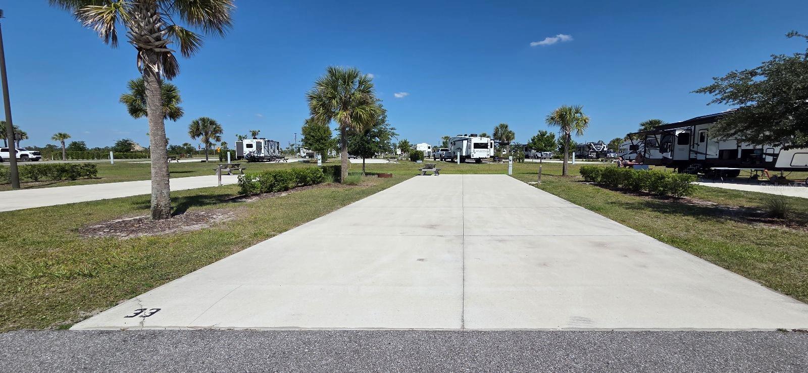 NEW Deeded RV Lots in Central FL! Welcome to Resort at Canopy Oaks, a brand new, modern, upscale RV Resort in Central Florida! Canopy Oaks sits on 435 acres filled with everything that you will need for your perfect RV experience. Enjoy first-class amenities such as a Resort style pool, hot tub, large tiki bar w/ full bar and sound system, live entertainment, tournament-style pickle ball courts, a spacious clubhouse, onsite cafe/deli and general store, fishing pond, on-site professionally managed activities, access to ILE Golf Course, large RV and Tiny Home/Cottage sites, pet and guest walking areas and free Wi-Fi throughout the resort! There is a professional on-site Management company to manage your Lot rentals if you would like to rent your Lot out when not in use! (Mgmt Fee 30/Owner 70.)
Each site comes with a concrete pad and is able to be upgraded to your liking! Add lush landscaping, a tiki hut, pavers, outdoor kitchen and seating areas and more! Make your RV Living dreams come true! All sites have 20-30-50 amp service and the monthly fee of $350 (billed quarterly) includes water, sewer, trash, electric, wi-fi, and landscape services. Cable TV is provided in common areas. Each owner pays respective property taxes to the County.
If you are an RVer and are looking for a home base in Florida, look no further than Resort at Canopy Oaks!