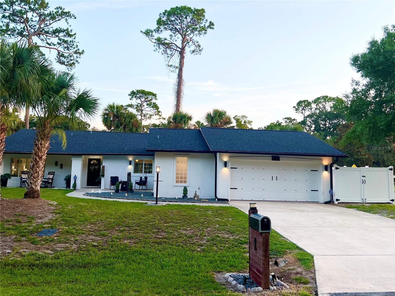 If you can imagine the perfect location... we have it! Welcome home to this stunning 3 bed, 3 bath POOL home, perfectly remodeled to exude elegance and sophistication, situated on the 3rd tee box in your backyard at Palm Harbor Golf Course! This incredible property boasts 2 primary suites, a huge corner lot with matching 12x10 shed, a concrete padded fenced storage area, NEW ROOF, A/C and pool motor, to name a few. The contemporary design boasts a timeless look, complimented by an amazing covered porch, beautifully landscaped grounds and is move -in ready. The custom black shiplap fireplace with wood cedar mantle, surrounded by sun drenched windows, offers breathtaking views of the golf course, birds, and squirrels, creating a true showstopper! The heated pool with new motor is screened from any neighboring views, overlooking the back nine and sunset views, complete with a soothing fountain. This open split-bedroom floorplan features a new custom kitchen, modern appliances, and porcelain driftwood tile flooring throughout. Custom touches include black shiplap on the entryway ceiling and kitchen nook. Each of the three bathrooms have modern tile work and sleek black rain head and handheld fixtures. Pride of ownership shines through in this coastal masterpiece! Enjoy the ultimate lifestyle with the Intracoastal just across the street for fishing, golfing in your backyard, strolling along the trails, dining, and shopping in European Village, plus the Sunday farmers market. A quick five minute drive takes you to the beach for sun and sand! Seize this incredible opportunity! All information recorded in the MLS intended to be accurate but cannot be guaranteed. TV's and brackets DO NOT Convey, garage and lanai refrigerators DO NOT Convey. Walls will be repaired from brackets!