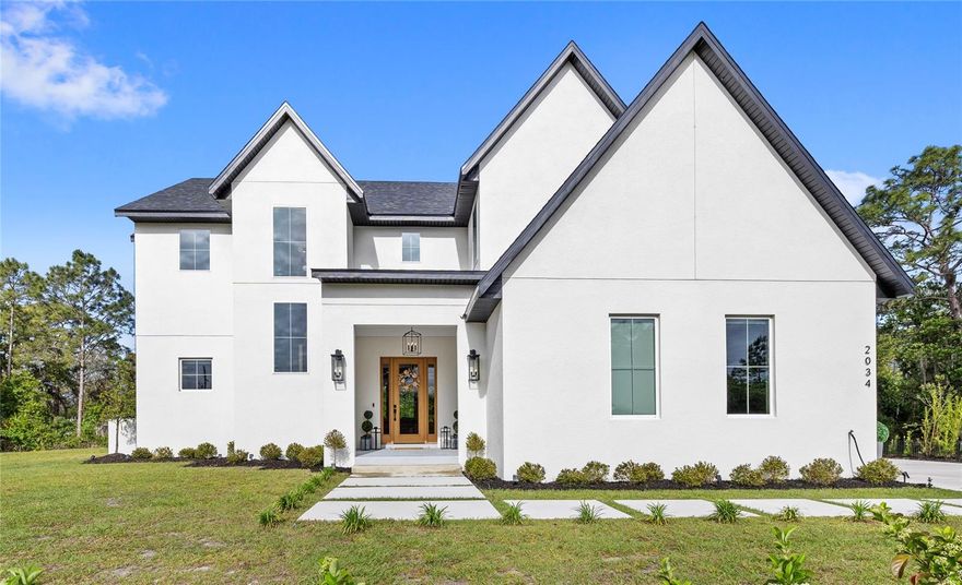 Modern European-inspired custom estate just minutes from Lake Nona, set on a rare 0.64-acre homesite with no HOA. Designed for elevated living, multigenerational flexibility, and effortless entertaining, this architect-designed residence blends dramatic scale with refined modern finishes.

From the moment you enter, soaring 20+ ft ceilings, expansive natural light, and a dramatic open-to-below great room create an unforgettable first impression. The heart of the home is a chef’s kitchen with Italian gas appliances, custom cabinetry, and an oversized island that flows seamlessly into the main living and outdoor entertaining spaces.

A true split-wing design offers exceptional privacy. The primary suite is its own private retreat, while a first-floor separate guest or in-law suite provides ideal independence for family or visitors. Upstairs, secondary bedrooms and a loft overlook the main living space, enhancing both openness and architectural impact.

Every detail was designed with intention: balancing comfort, function, and long-term flexibility in a true custom build environment.

Located minutes from Lake Nona, Medical City, dining, shopping, Orlando International Airport, and major highways, this home offers rare privacy and scale in one of Central Florida’s fastest-growing corridors.

This is not production housing by any means. It is a fully custom, architect-designed estate built for elevated living.

Seller will review all offers on Sunday at 6 PM, while reserving the right to accept an offer prior to the deadline.