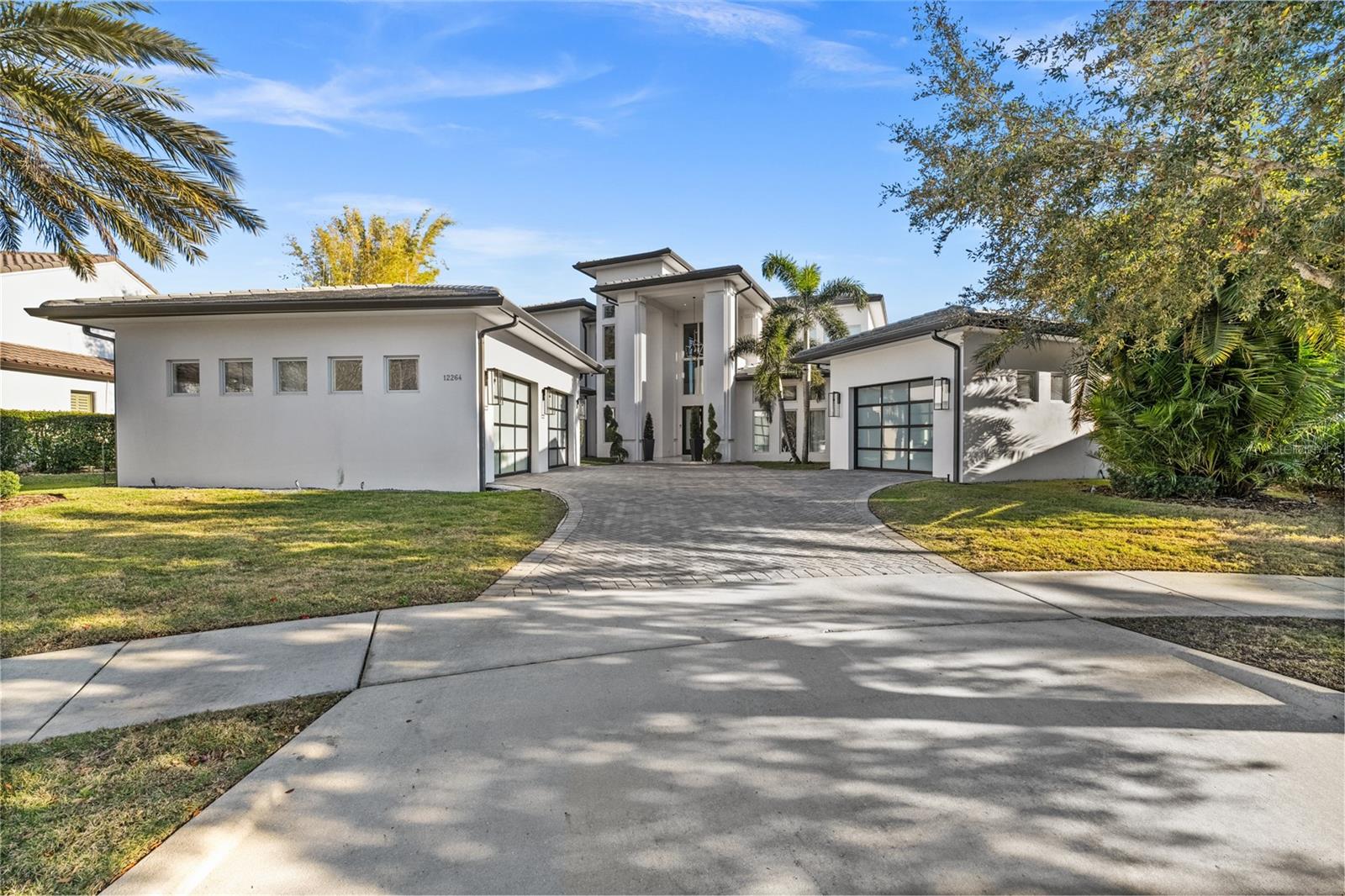 Lakefront, Luxurious, Fully Furnished Home with Private Pool in Windermere.
A True Paradise!
Discover this rare gem in the heart of Windermere, located in the gated community of Casa Del Lago — a spectacular residence that combines sophistication, comfort, and stunning lake views. Fully furnished, with over eight expertly designed rooms, this home was carefully customized by the builder down to the smallest detail — from the finishes to the overall design.
With four suites, four full bathrooms, and three powder rooms, this home was designed to delight at every turn. Upon entering, you're welcomed by a grand entry hall with soaring ceilings over 10 feet high and elegant porcelain tile flooring, enhancing the space’s refined atmosphere. The living room, complete with a fireplace, offers a cozy yet sophisticated ambiance, while the kitchen is a showstopper: spacious and equipped with state-of-the-art stainless steel appliances, quartz countertops, a large island with a waterfall design, and impeccably finished custom cabinetry.
The master suite, located on the second floor, is a true retreat. It features a private sitting area, a fireplace, and a spa-like bathroom with a double shower, dual sinks, and a sophisticated design focused on your comfort. In addition to the master suite, the second floor includes additional bedrooms and a versatile living area, ideal for use as a home theater or game room. On the ground floor, a guest suite provides the perfect space for entertaining visitors.
The home also offers expansive balconies on both floors with panoramic lake views, seamlessly connecting indoor living areas to a breathtaking outdoor setting. Outdoor features include a terrace, a deck, a pool with a resort-style spa, and a gourmet area — perfect for entertaining friends and family.
The entire home is hurricane-proof, offering maximum safety and peace of mind for your family.
Located in one of Florida's most desirable areas, you'll be near fine dining, luxury shopping, premier entertainment, and, of course, just minutes from the Disney Parks.
Don’t miss this unique opportunity to live in style at one of Windermere’s most prestigious addresses. Schedule your visit today and experience this true gem in person!