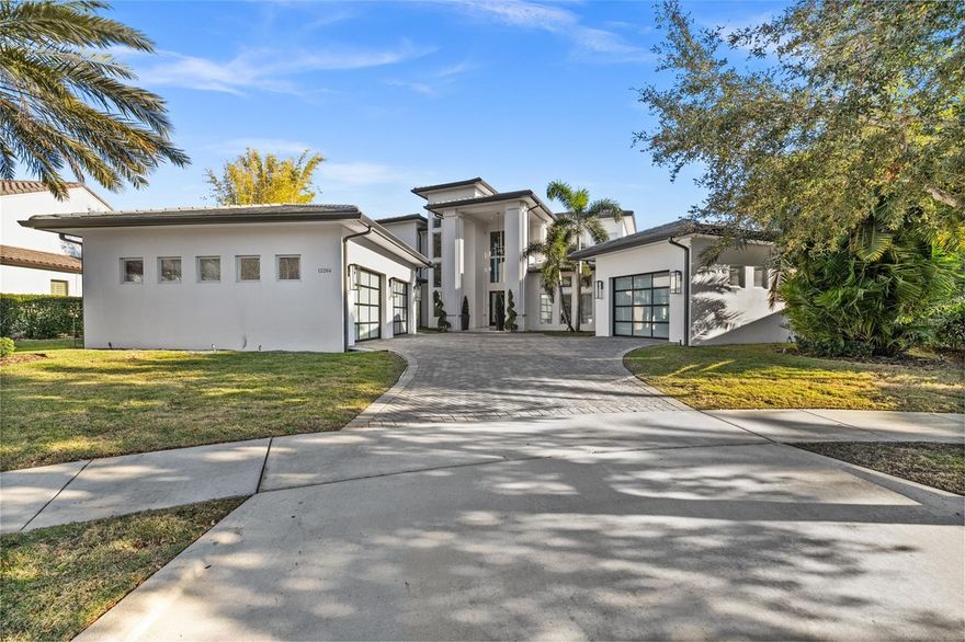 Lakefront, Luxurious, Fully Furnished Home with Private Pool in Windermere.

A True Paradise!
Discover this rare gem in the heart of Windermere, located in the gated community of Casa Del Lago — a spectacular residence that combines sophistication, comfort, and stunning lake views. Fully furnished, with over eight expertly designed rooms, this home was carefully customized by the builder down to the smallest detail — from the finishes to the overall design.

With four suites, four full bathrooms, and three powder rooms, this home was designed to delight at every turn. Upon entering, you're welcomed by a grand entry hall with soaring ceilings over 10 feet high and elegant porcelain tile flooring, enhancing the space’s refined atmosphere. The living room, complete with a fireplace, offers a cozy yet sophisticated ambiance, while the kitchen is a showstopper: spacious and equipped with state-of-the-art stainless steel appliances, quartz countertops, a large island with a waterfall design, and impeccably finished custom cabinetry.

The master suite, located on the second floor, is a true retreat. It features a private sitting area, a fireplace, and a spa-like bathroom with a double shower, dual sinks, and a sophisticated design focused on your comfort. In addition to the master suite, the second floor includes additional bedrooms and a versatile living area, ideal for use as a home theater or game room. On the ground floor, a guest suite provides the perfect space for entertaining visitors.

The home also offers expansive balconies on both floors with panoramic lake views, seamlessly connecting indoor living areas to a breathtaking outdoor setting. Outdoor features include a terrace, a deck, a pool with a resort-style spa, and a gourmet area — perfect for entertaining friends and family.

The entire home is hurricane-proof, offering maximum safety and peace of mind for your family.

Located in one of Florida's most desirable areas, you'll be near fine dining, luxury shopping, premier entertainment, and, of course, just minutes from the Disney Parks.

Don’t miss this unique opportunity to live in style at one of Windermere’s most prestigious addresses. Schedule your visit today and experience this true gem in person!