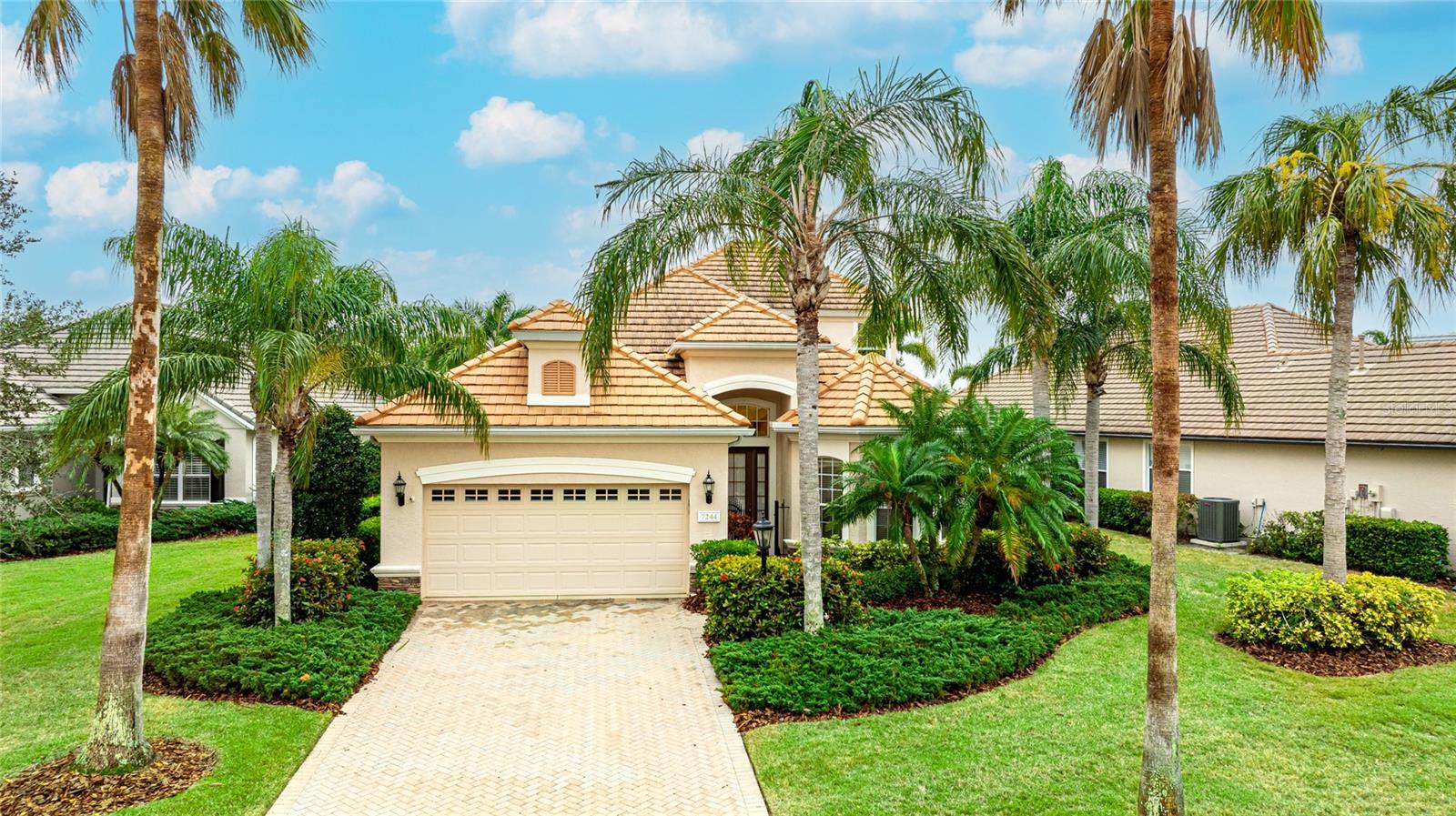 **SELLER MOTIVATED!!!** Nestled on a tranquil cul-de-sac in the sought-after Lakewood Ranch Golf & Country Club, this elegant 4-bedroom, 3-bathroom pool home offers a harmonious blend of sophistication and comfort. From the moment you arrive, a charming wrought iron gate welcomes you, setting the tone for what lies beyond. Step inside to a grand foyer adorned with a formal dining room and a sweeping staircase, creating a stunning first impression. The open-concept living space beckons with its seamless flow, featuring a family room with triple sliding glass doors that invite you to the private outdoor oasis. The sparkling pool, spacious lanai, and serene peek-a-boo views of the golf course make this the perfect setting for weekend barbecues and sun-soaked afternoons. The kitchen boasts stainless steel appliances, a convenient breakfast bar, a pantry, and an adjacent casual dining nook that overlooks the pool. The first-floor primary suite offers a peaceful retreat, complete with a cozy sitting area and an ensuite featuring a soaking tub, a walk-in tiled shower, and dual vanities. A bedroom at the front of the home, enhanced by a pocket door that ensures both privacy and convenient ensuite access to the first-floor bathroom, provides a comfortable space for visitors. Ascend the elegant staircase to discover two additional bedrooms, each framed by French doors, and a full hall bathroom, creating the ideal space for family or guests. Beyond the home, immerse yourself in the vibrant lifestyle that Lakewood Ranch Golf & Country Club is known for. Take advantage of the extensive biking and walking trails, scenic golf courses designed for all skill levels, and the charming allure of downtown Lakewood Ranch Main Street. Waterside Place adds to the appeal with its lively farmers' markets and ranch night festivities, offering a perfect blend of community and entertainment. With convenient access to I-75 and the renowned UTC shopping district, this home truly places everything at your fingertips. **THIS PROPERTY QUALIFIES FOR A 1% LENDER INCENTIVE IF USING PREFERRED LENDER. INQUIRE FOR MORE DETAILS.**