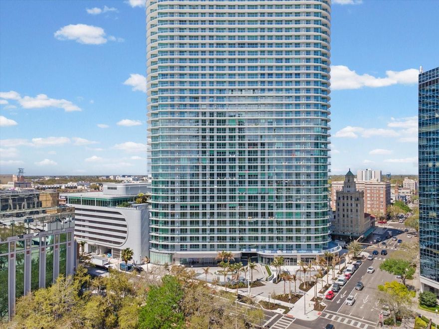 One or more photo(s) has been virtually staged. Live above it all at The Residences at 400 Central, downtown St. Petersburg’s newest luxury condominium tower. This stunning 16th-floor residence offers sweeping bay and city views through expansive floor-to-ceiling glass doors, filling the home with natural light. The thoughtfully designed 2-bedroom, 2.5-bath split floor plan features 10-foot ceilings, modern finishes, and an open-concept living space ideal for entertaining. The gourmet kitchen is equipped with high-end JennAir appliances, sleek cabinetry, and premium finishes. Both bedrooms feature private ensuite baths, providing comfort and privacy. Step onto the large private balcony to enjoy spectacular views of Downtown St. Petersburg, the Skyway Bridge and beautiful Tampa Bay. Residents enjoy exceptional amenities including a resort-style pool, state-of-the-art fitness center, dog park, business center, outdoor kitchens and grills, and bocce ball court. The building will also feature a spectacular 46th-floor glass Sky Lounge and observation deck with panoramic city and water views. Ideally located in the heart of downtown St. Petersburg, just steps from dining, shopping, waterfront parks, museums, and the St. Pete Pier.