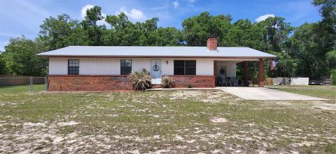 Photo of 115 Fern Way, San Mateo, FL 32187 (MLS # O6401068)