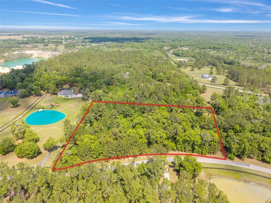 Discover serenity, privacy, and endless possibilities on this exceptional 4.12-acre parcel located in the distinguished gated community of Estates at Cotton Plant. This newly listed vacant lot offers a rare opportunity to build your dream home in a neighborhood known for upscale living, natural beauty, and a peaceful rural atmosphere.

Perfectly situated toward the back of the subdivision on an no outlet road, this property provides added privacy and a tranquil setting. The land is graced with an abundance of beautiful oak trees, creating a stunning natural backdrop and allowing you to design your custom estate around their timeless beauty.

Estates at Cotton Plant offers more than just luxury homes—it offers a lifestyle. Residents enjoy underground utilities, a beautifully landscaped entrance, and approximately three miles of walking and riding trails, perfect for morning jogs, evening strolls, or simply taking in the scenic surroundings.

For equestrian enthusiasts and nature lovers alike, this property is especially appealing. Enjoy frequent wildlife sightings and the peaceful charm of country living, all while being just a short drive from the World Equestrian Center. This is a wonderful opportunity to create the estate you’ve always envisioned in a community that blends luxury, privacy, and natural beauty.