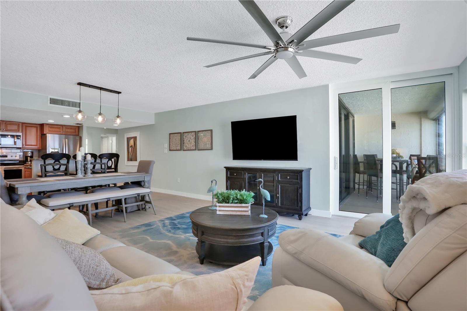 Discover your coastal oasis at Sand Dollar III, perfectly situated on the shores of St. Augustine Beach. This delightful 5th floor, 3-bedroom, 2-bathroom condo features an airy open layout, ideal for both relaxation and gatherings. Step onto the picturesque balcony, also accessible from the primary suite, and soak in mesmerizing views of the serene surroundings. Complete with pools, tennis courts, and private beach access, every day feels like a getaway. Sand Dollar III offers an array of amenities including a clubhouse with a kitchen, lounge, game tables, gym, and extra storage space. Open parking just outside the unit, this condo epitomizes coastal living at its finest. Fully furnished with all appliances, it's ready to welcome you home to beachside bliss. Building has an elevator and the first bedroom has been enclosed with a barn door.