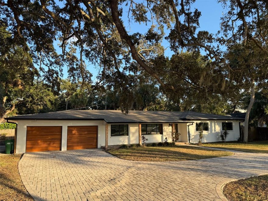 Discover one of South Tampa’s rarest opportunities — an oversized 0.30-acre lot (approx. 110 ft x 117 ft) in the prestigious Sunset Park neighborhood. Zoned for A-rated Mabry, Coleman, and Plant High School, this property sits among multi-million-dollar estates and captures breathtaking sunset views over the water. Whether you choose to renovate the existing home or demolish and rebuild a custom residence, this address offers unmatched potential in one of Tampa’s most coveted enclaves.

The current 3-bedroom, 2-bathroom, 2-car garage home experienced flooding during Hurricane Helene, creating a blank canvas for investors and homeowners ready to reimagine the space. The structure still features GPT hurricane-proof windows and doors and a spacious open layout with a large living area leading to a covered lanai and expansive backyard — all overlooking tranquil water views.

The oversized lot provides flexibility for a pool, guest house, or total redevelopment. A roundabout driveway, two-car garage, and additional car pad ensure convenient parking for family and guests. The surrounding streets are lined with mature trees, luxury new construction, and the peaceful charm that makes Sunset Park a long-time favorite for those seeking both prestige and community.

This property is being sold as-is, offering buyers the opportunity to capitalize on its prime location and generous lot size. Buyer to verify all measurements, dimensions, and property details.

This location checks every box: top schools, water views, premier neighborhood, and a lot large enough to build your dream home. Opportunities like this rarely hit the market — secure your footprint in one of Tampa’s most exclusive areas today.