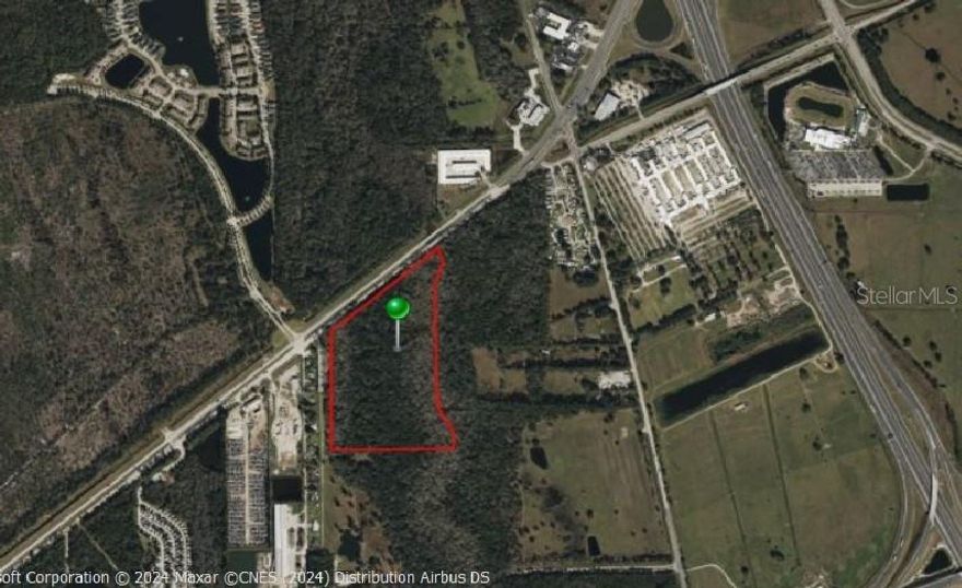 The 30-acre property located on W International Speedway Boulevard in Daytona Beach, FL, is situated in a prime area with significant commercial and residential development potential. This area is known for its high traffic volume due to its proximity to the Daytona International Speedway, making it an attractive location for businesses and developments aiming to benefit from the visibility and accessibility of this major thoroughfare.
Land Features and Zoning

The property features a flat, level terrain that is suitable for a variety of uses. It has substantial frontage on W International Speedway Boulevard, offering excellent visibility and access. The zoning allows for both commercial and residential development, providing flexibility for future use. The land's dimensions and specific features make it a valuable asset for developers looking to invest in a rapidly growing area.

Daytona Beach is a vibrant city known for its tourism, motorsports, and growing residential communities. The area around W International Speedway Boulevard is characterized by a mix of commercial establishments, including retail stores, restaurants, and service-oriented businesses. The region is experiencing significant growth, with new developments contributing to an increasing population and economic activity.

The population within a 5-mile radius of the property is approximately 105,000.   The economy of Daytona Beach is largely driven by tourism, education, and healthcare sectors.  The presence of Daytona International Speedway and events such as the Daytona 500 significantly boost local business activities.

The property is easily accessible via major highways, including Interstate 95, which enhances its appeal for commercial purposes.
Public transportation options and the development of bike-friendly infrastructure are improving connectivity in the area.

The surrounding community includes a diverse range of amenities such as schools, healthcare facilities, shopping centers, and recreational areas.  The presence of educational institutions and healthcare facilities indicates a well-rounded community infrastructure supporting both residential and commercial growth.