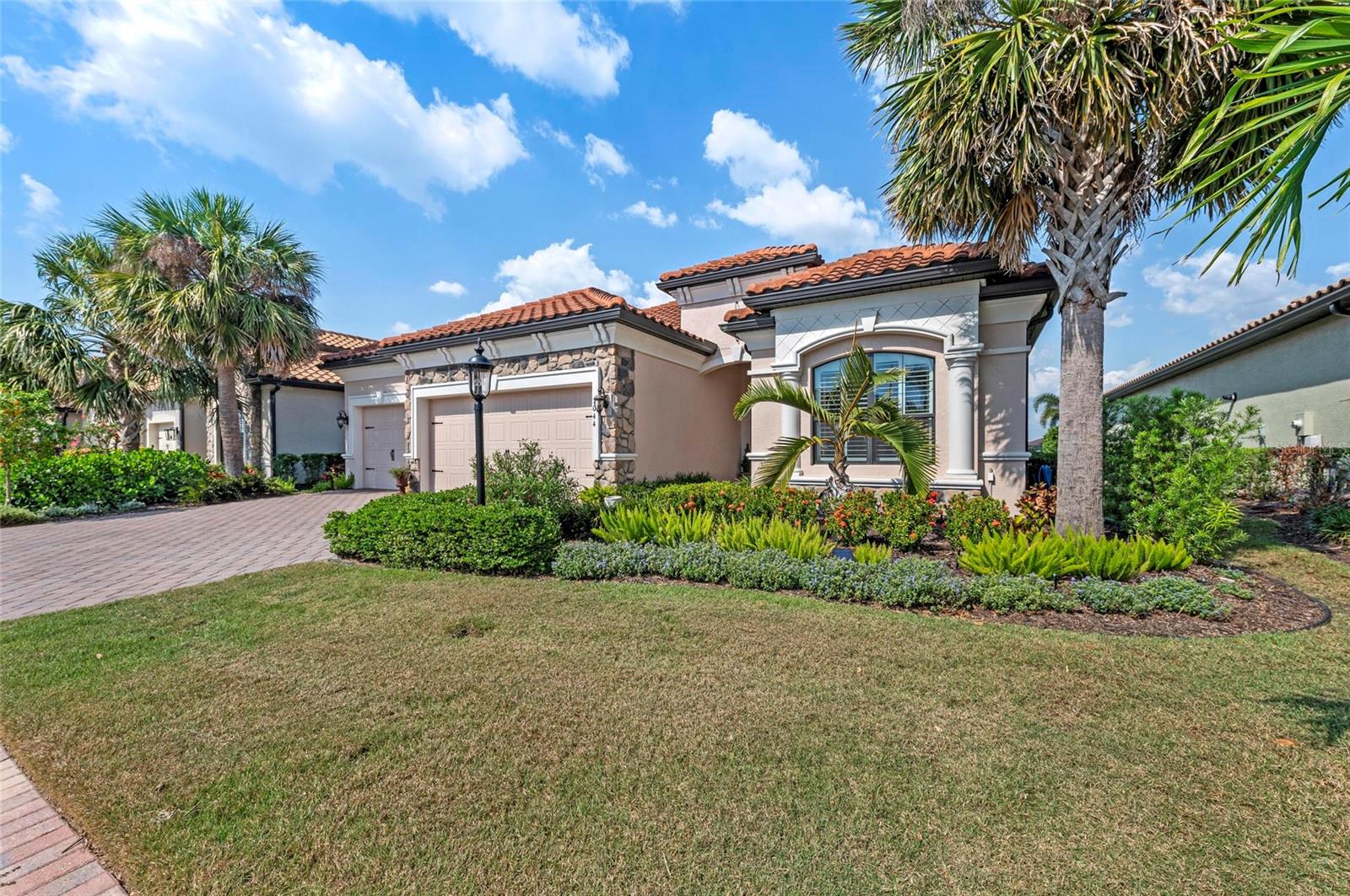 Stunning Lakefront Home with Premier View in Country Club East, where elegance meets tranquility in the heart of Lakewood Ranch. This beautifully updated home boasts the best lake view in the entire neighborhood—a true showstopper that delivers breathtaking views and a peaceful backdrop every day.
Step inside to discover a thoughtfully designed floor plan filled with natural light and upscale finishes. The lanai has been transformed with a brand new panoramic screen, offering unobstructed views of the water—perfect for relaxing or entertaining at the outdoor kitchen. You'll also love the charming wood ceiling detail on the lanai and front porch, adding warm character and curb appeal.
The interior features updated countertops that enhance the bathroom’s modern style, making it a relaxing retreat. Every space in this home has been meticulously maintained and recently enhanced, offering a move-in ready experience for the next lucky homeowner.
Located within the gates of Country Club East, residents enjoy resort-style amenities, walking trails, and close proximity to world-class golf, shopping, dining, and top-rated schools. The Longcliffe area of Country Club East has an active social committee that brings residents together for lots of different activities.
Don’t miss this rare opportunity to own a slice of paradise with unmatched lake views and fresh, stylish updates.