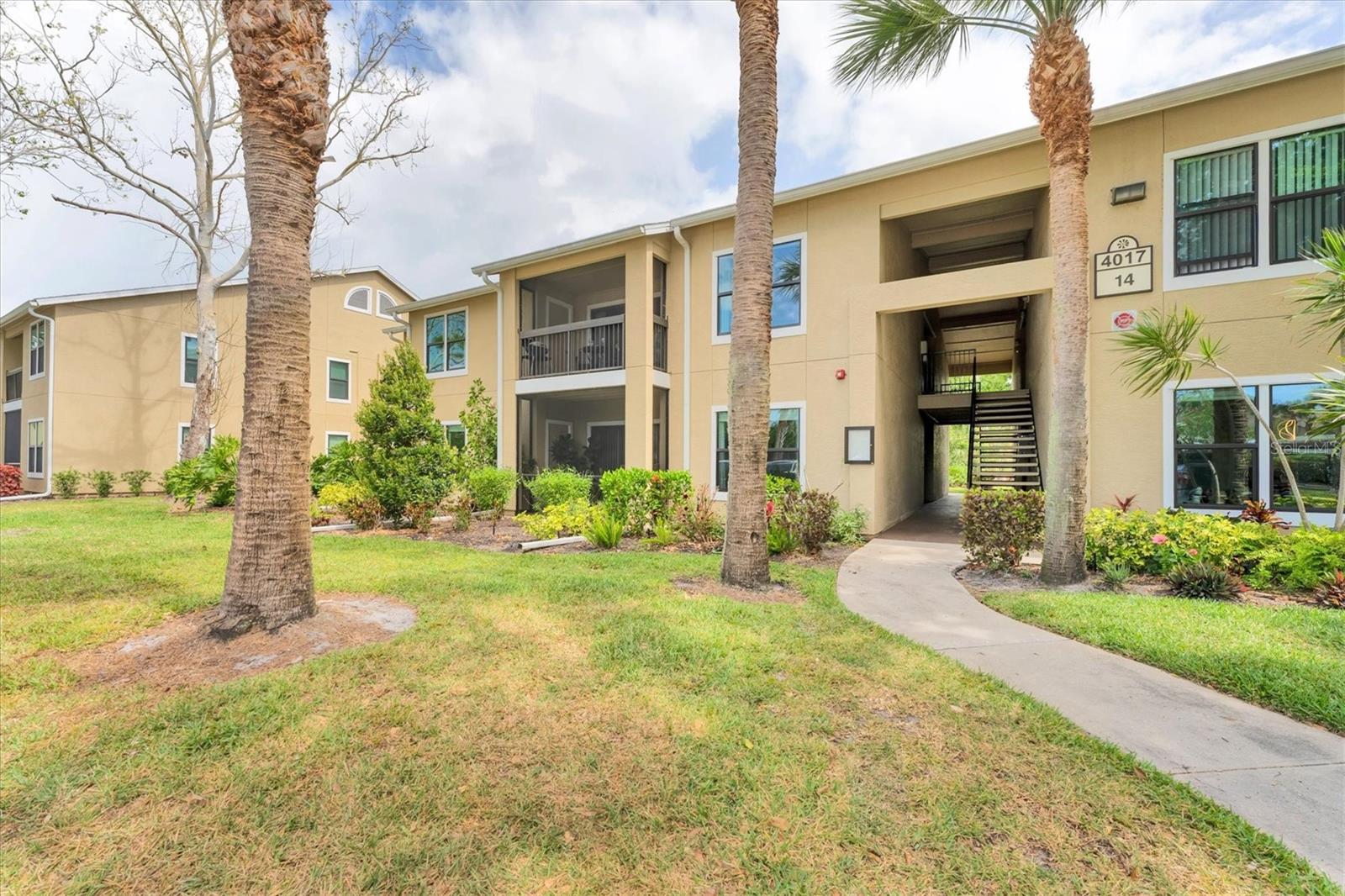 This is the BEST VALUE 3-bed 2-bath condo in ALL of coveted Palmer Ranch. Nestled in the serene and natural setting of Vintage Grand, this 2nd story light-filled end unit is graced with floor-to-ceiling sliding glass doors that lead to a covered screened patio, perfect for your morning coffee. With vaulted ceilings, a large kitchen, a roomy dining area and plenty of closet space, this move-in-ready condo is priced to sell and is available turnkey furnished. This condo boasts 1,260 ft² of living space and has an in-unit washer and dryer, and not one, but two screened in patios. One patio has a storage closet for your beach gear, and the other private screened patio is located off the 2nd of the 3 sizable bedrooms. The spacious main bedroom has an abundance of natural light, a walk-in closet, an en-suite bath, and access to the main patio. Enjoy all the amazing amenities this complex has to offer, including a clubhouse, fitness center, playground, 2 resort-style pools complete with hot tub, walking trails, a lake with fishing dock, outdoor grilling and picnic areas, a carwash station, as well as tennis and basketball courts. Ample guest parking. A/C replaced in 2017. Dishwasher & water heater both replaced within the past 4-5 years. Roof replaced in 2024 and hurricane-rated windows. Perfect for year-round enjoyment, an income producing rental, or as your winter getaway, this PET FRIENDLY unit comes equipped with all you’ll need for an “instant vacation”. Close to top-rated schools, great shopping, great dining and the #1 beach in the US, this unit checks ALL the boxes. Vintage Grand is minutes from countless recreational and cultural activities, downtown Sarasota and the interstate. Perfect for a family or your vacation getaway, you’ve got the YMCA and Costco practically right outside your door! Lowe’s, Target and Publix are down the street. With a low HOA of just under $600 a month and all assessments paid, this well-maintained unit is a steal. Covered parking is available for $30 per month.