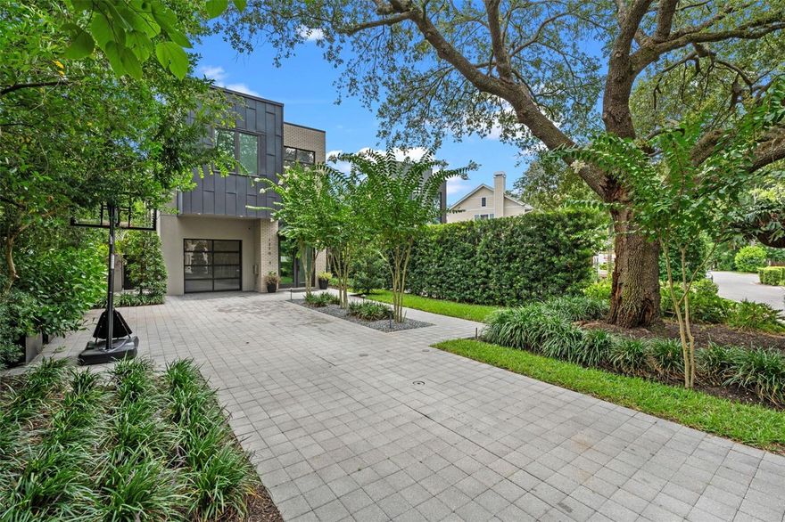 Modern Elegance in the Heart of Winter Park!

Located just a half-mile from the renowned shops and dining of Park Avenue, this architecturally striking residence blends luxury, modern design, and thoughtful functionality. Designed by Michael Wenrich and built by Jim Winters, every inch of this home reflects exceptional craftsmanship and elevated taste.

A long paver driveway welcomes you with ample guest parking and leads to a bold yet welcoming facade—complemented by large-scale windows and a sleek glass garage door. Natural light floods the interior, emphasizing the open-concept floor plan and seamless indoor-outdoor flow.

Step into a dramatic two-story foyer and be welcome inside to wide-plank wood flooring, modern lighting, tall baseboards, and a black metal staircase railing. The main living spaces are open and airy, anchored by a gas fireplace with a floor to ceiling mantle.

At the heart of the home is a show-stopping kitchen equipped with GE Monogram appliances, including a gas range and under-counter microwave. An eat-in[.n.,mmnm, waterfall island, complemented by under-cabinet lighting, a marble backsplash, and double-barrel under-mount sink with extendable faucet.

Tall glass doors and expansive windows blur the lines between inside and out. A collapsible sliding glass wall opens to the private backyard, featuring a cocktail pool, outdoor shower, lounge deck, and built-in plumbing for a future summer kitchen. Mature landscaping ensures privacy and serenity.

Upstairs, you’ll find three spacious en-suite bedrooms, each with custom closets, high ceilings, and stylish, neutral finishes. The second-floor laundry room adds convenience with matching cabinetry and a stainless utility sink.

The primary suite is a true retreat, offering direct access to a private upper deck overlooking the backyard. The spa-inspired bathroom features a dual-head glass-enclosed shower, floating double vanity, custom closets, and elegant lighting.

This home is a rare opportunity to own a piece of modern luxury just steps from everything Winter Park has to offer.

Schedule your private showing and experience this stunning home for yourself.