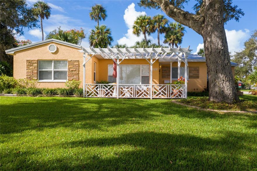 A short walk to New Smyrna Beach Canal Street district, this hidden gem is a beautiful well maintained home on the highly desirable North Riverside Drive located on the New Smyrna Beaach/Edgewater city line. A glimpse of the best of Florida Living, this home is situated on an elevated, oversized, corner lot and is surrounded by many restored, Victorian/ Craftsman style homes in a quiet and peaceful neighborhood. Your view from the front porch gives you access to gaze at the passing boats on the pristine intercostal waterway, or take your kayaks out for a sunset cruise alongside manatees and dolphins, a spacious enclosed Lanai with access to a fenced back yard and lush landscaping. Stroll or bike along the beautiful Intercostal River, launch your kayak or boat from the many community launch parks, or relax with your fishing pole and let your cares melt away. The interior features; oversized living room, large kitchen with newer cabinets, quartz counter tops and plenty of storage space. Stainless steel appliances along with plenty of counter space makes cooking enjoyable. A separate dining-room sits off the kitchen along with the interior laundry, storage closet, and a 1/2 bath. This home is just miles to historical Canal Street and Flagler Avenue for shopping, services, Post Office, restaurants, festivals, and beautiful sunset walks along the Intracoastal waterway.!! With quick and easy access to major highways of I-95 and State Road 44. ;Water: City